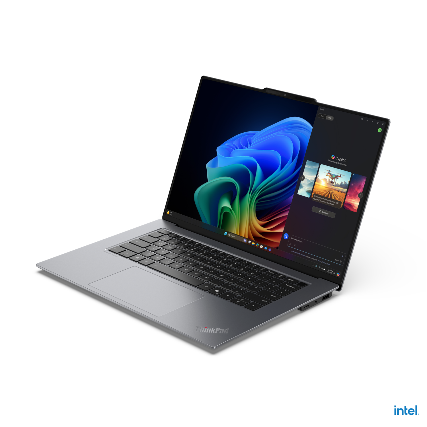 A laptop with a large screen is open, displaying a colorful image and a sidebar.