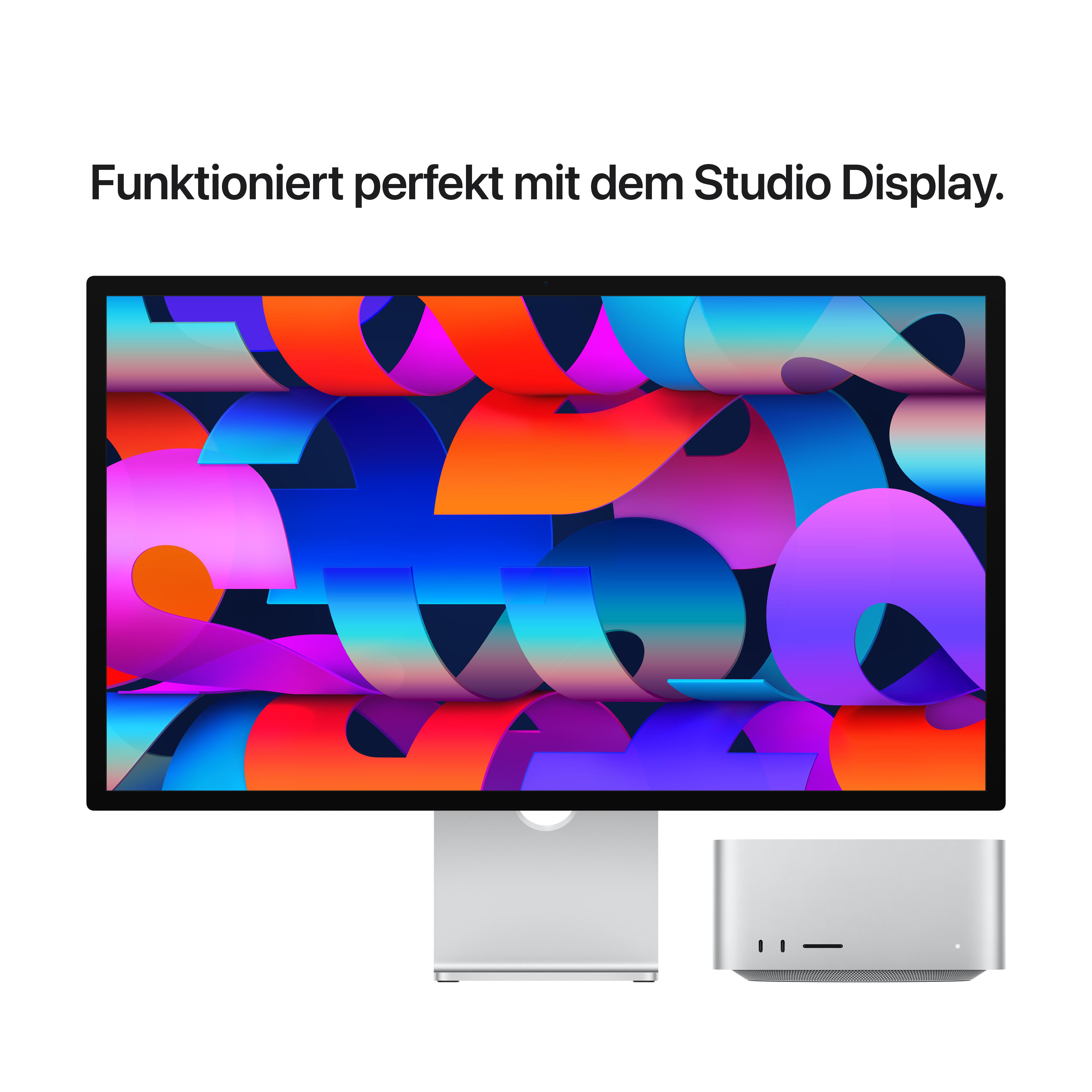 Ein Monitor zeigt ein farbenfrohes Bild, daneben ein Computer.
