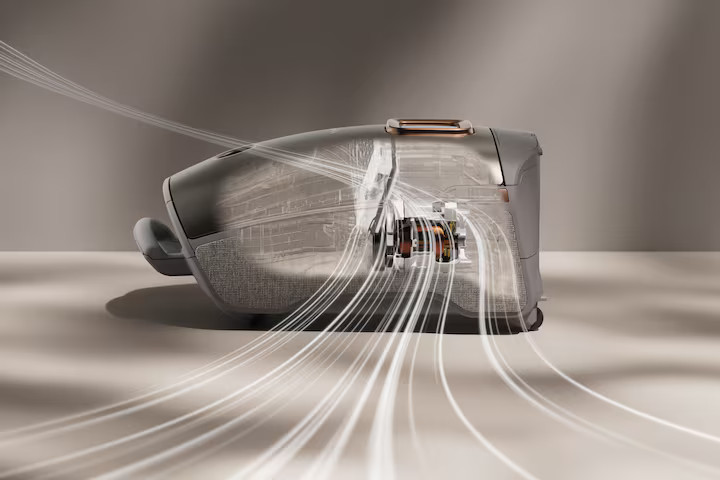 Słuchawki douszne, widok przekroju, z elementami wewnętrznymi i liniami przepływu powietrza.