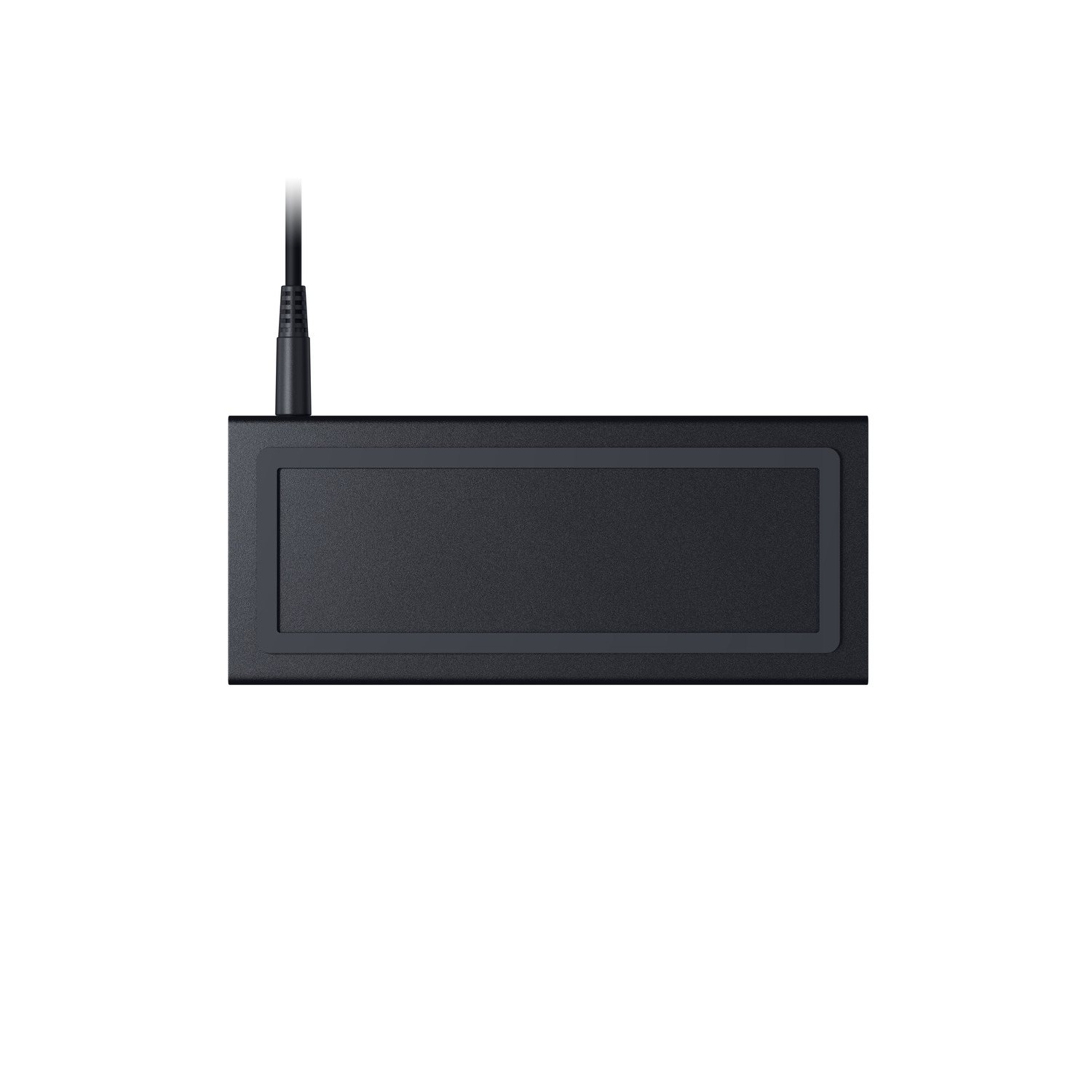 A black power adapter. It is rectangular with a black cord attached. The adapter is on a white surface.
