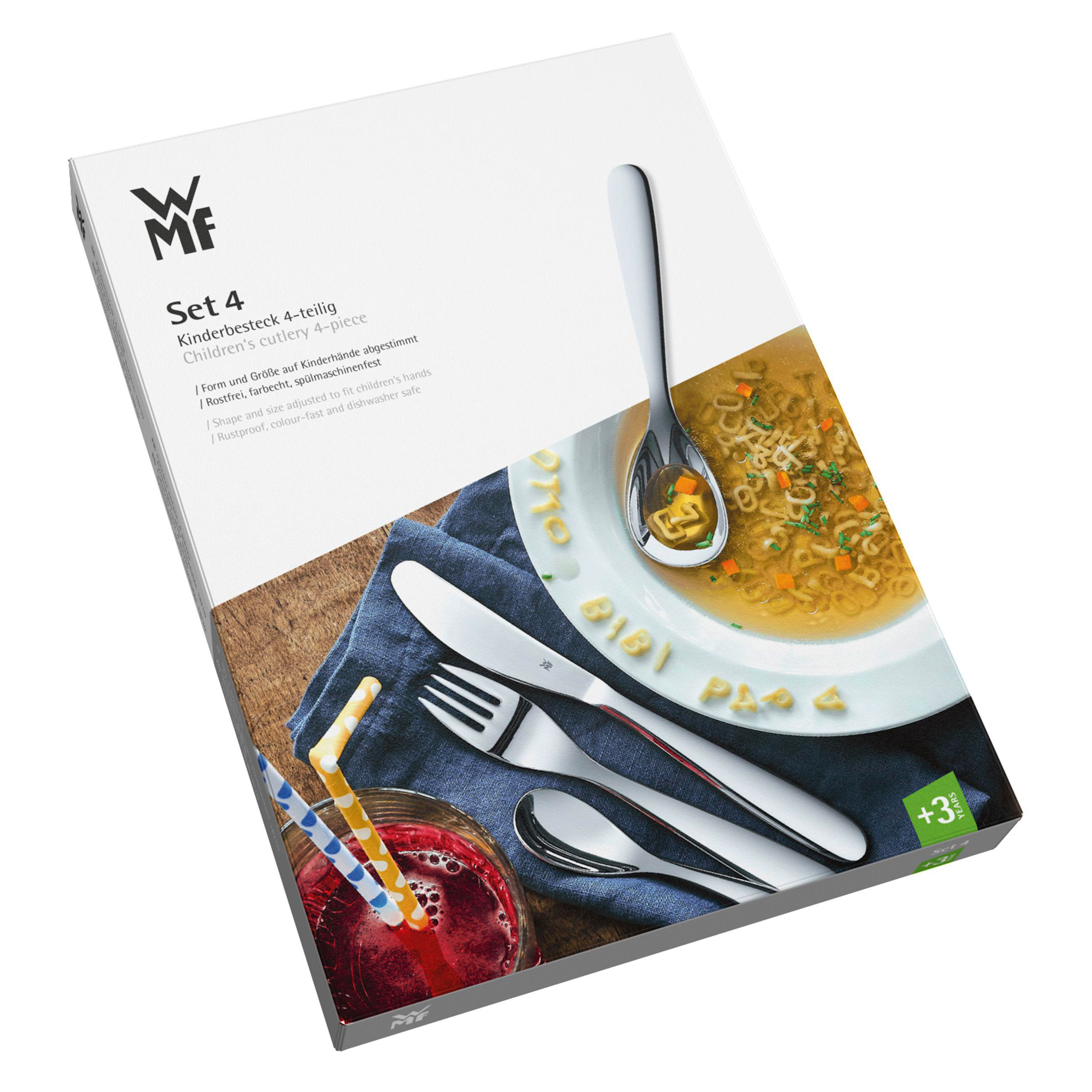 Verpacktes Kinderbesteck-Set mit Suppe und Besteck auf einem Tisch. Weißer Hintergrund.