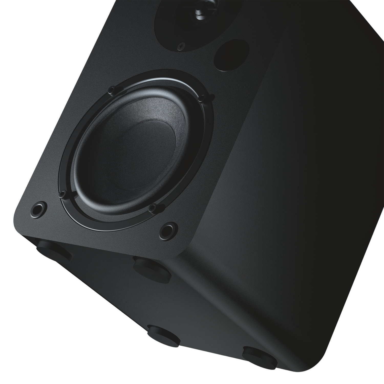 A black speaker with a visible woofer and rubber feet.