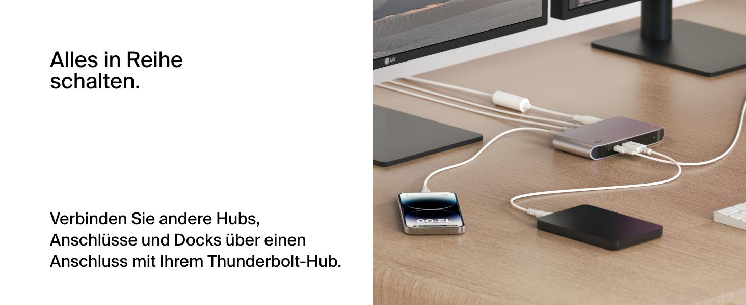 Ein Schreibtisch-Setup mit einem Thunderbolt-Hub, Telefon und externer Festplatte.