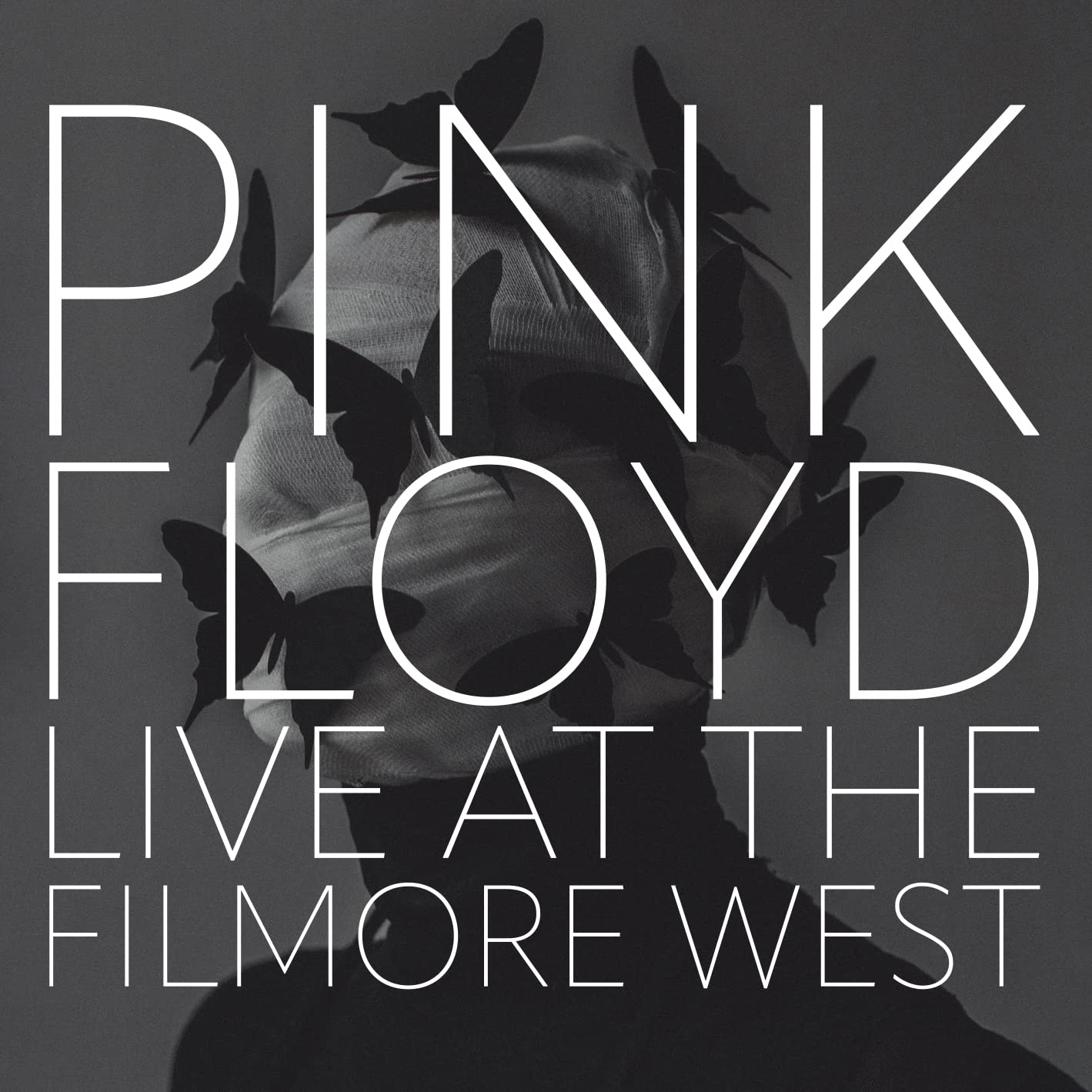 Pink Floyd album borító: egy arc pillangókkal, és a szöveg: Pink Floyd Live at the Filmore West.