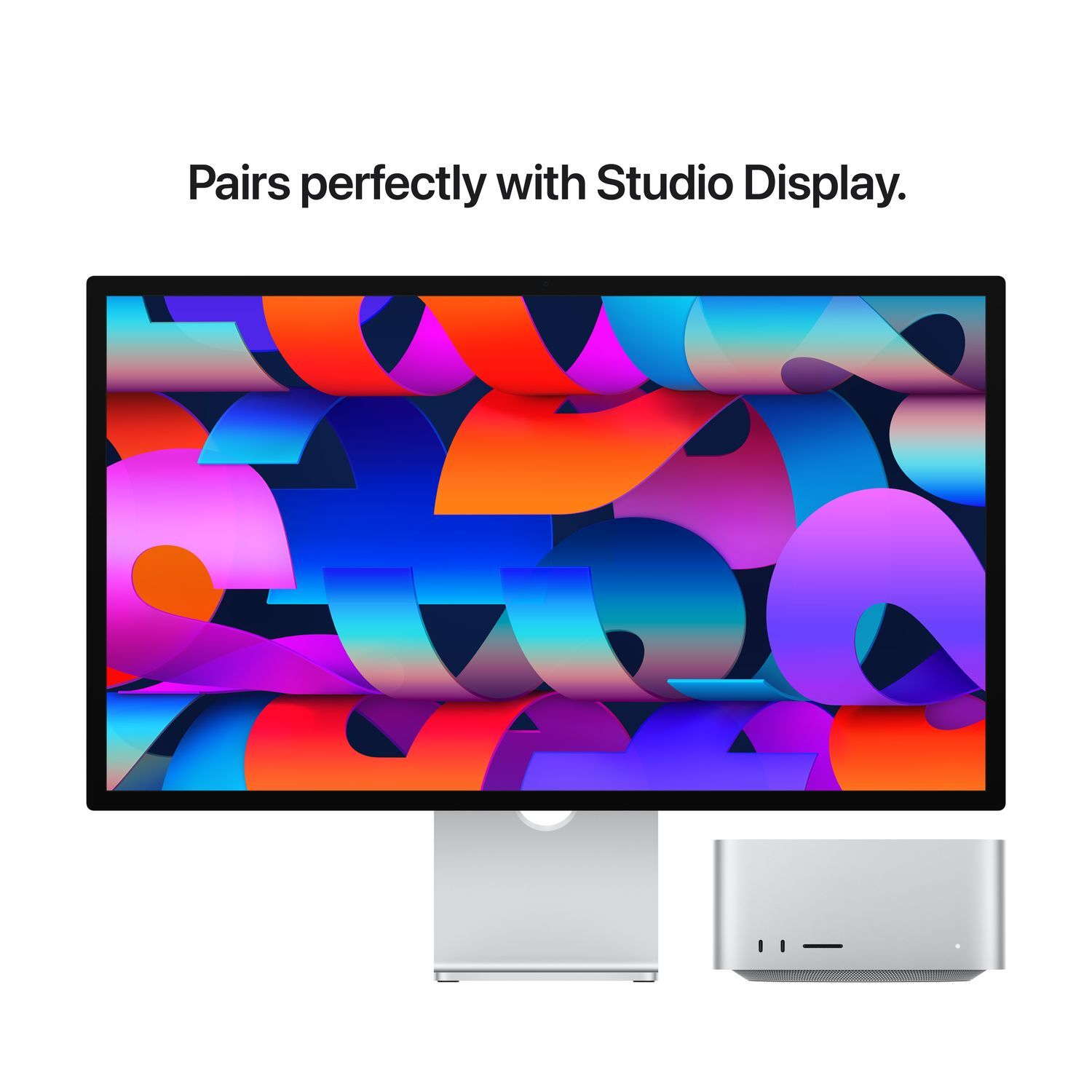 Apple Studio Display and Mac Studio on a white surface, with a colorful abstract background.