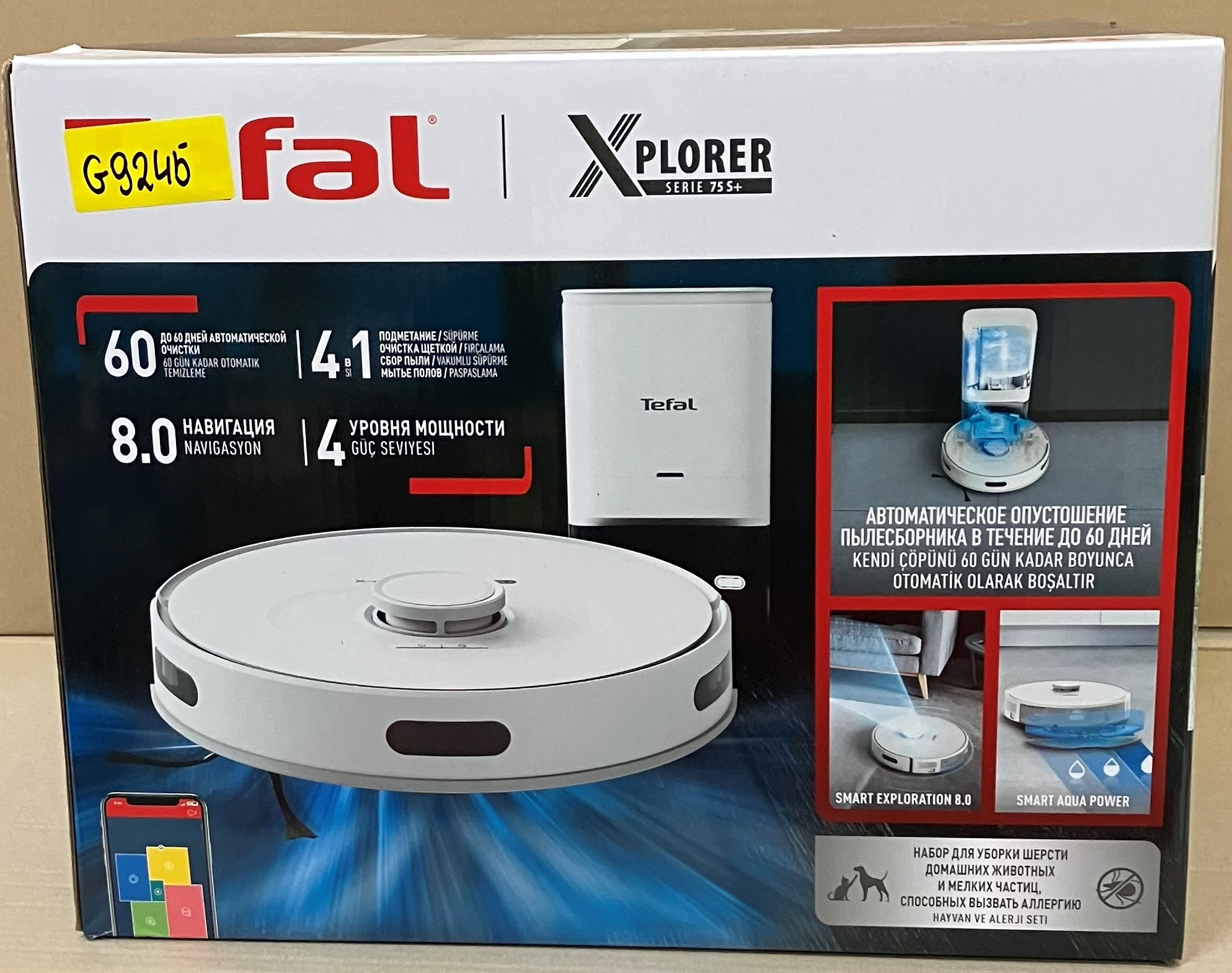 Pudełko z robotem odkurzającym, biało-czarne, z marką i wyświetlanymi funkcjami.