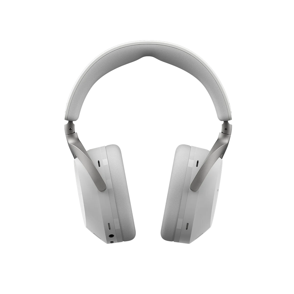 Primer plano de auriculares inalámbricos blancos sobre fondo negro.