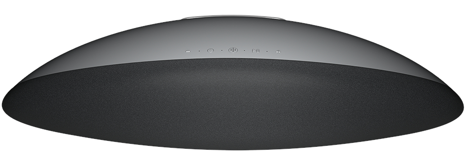 Czarny głośnik o owalnym kształcie z ciemnoszarym materiałowym przodem i przyciskami sterowania na górze.