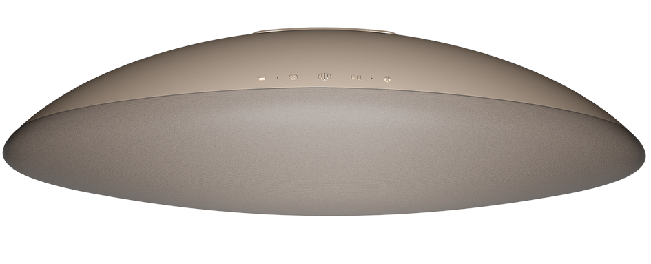 Beżowy, owalny głośnik z metalicznym wykończeniem, z szeregiem elementów sterujących na górze.