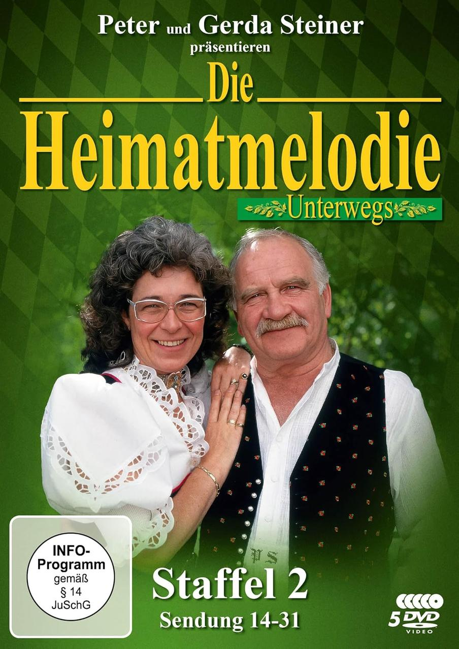 DVD-Cover von Die Heimatmelodie Unterwegs. Zwei lächelnde Personen. Grüner und gelber Text.