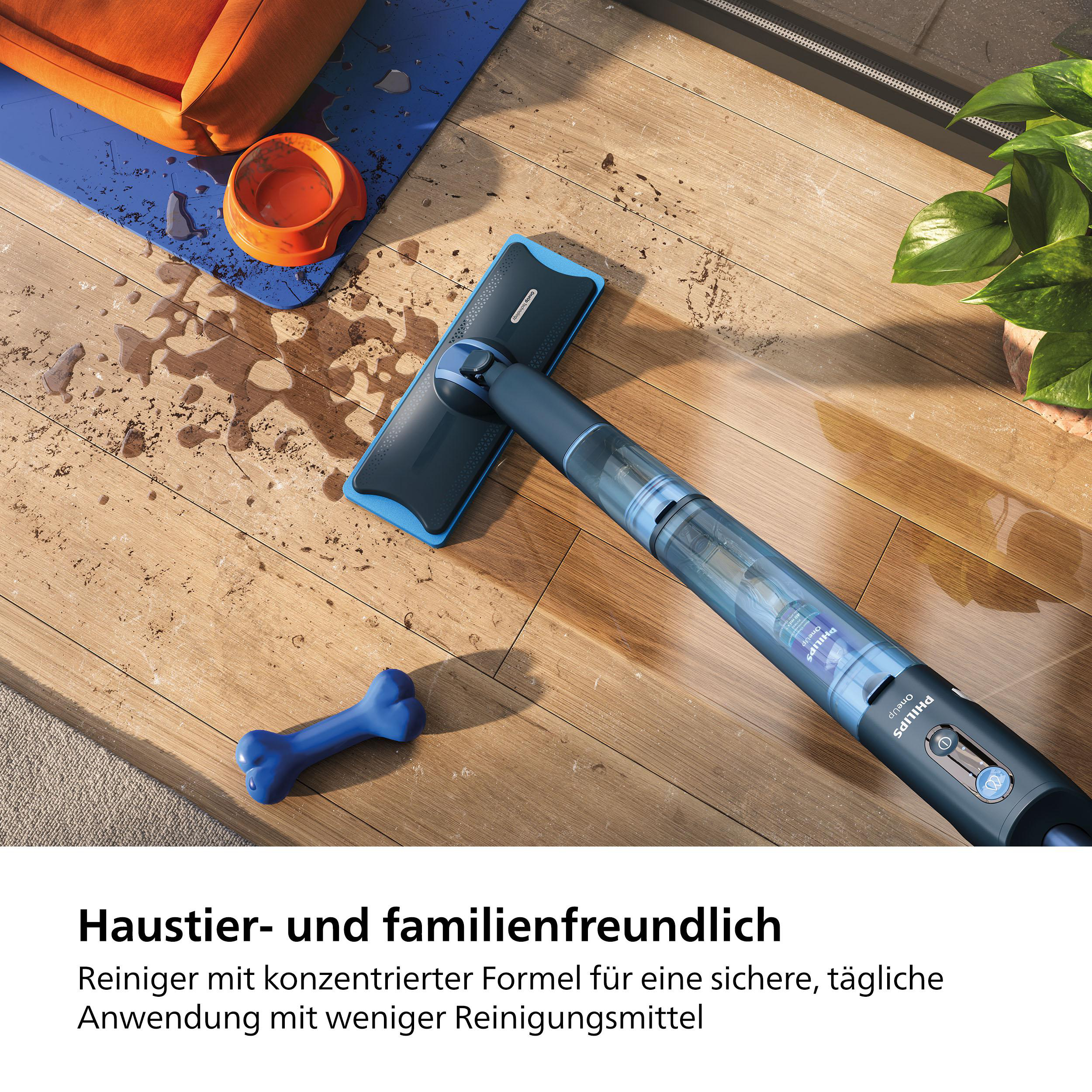 Philips AquaTrio Staubsauger auf Holzboden mit Objekten.