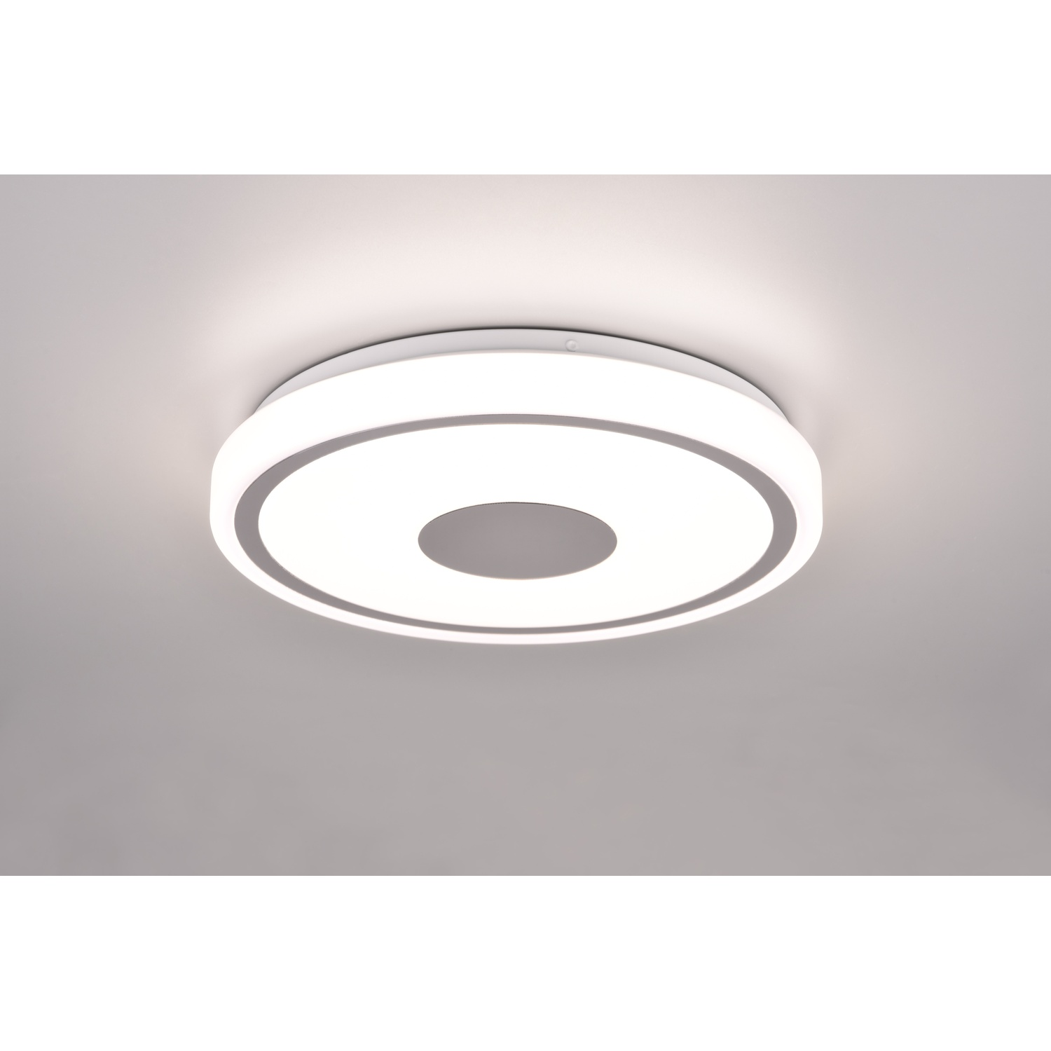 Lampada da soffitto. Design circolare con luce centrale e anello circostante.