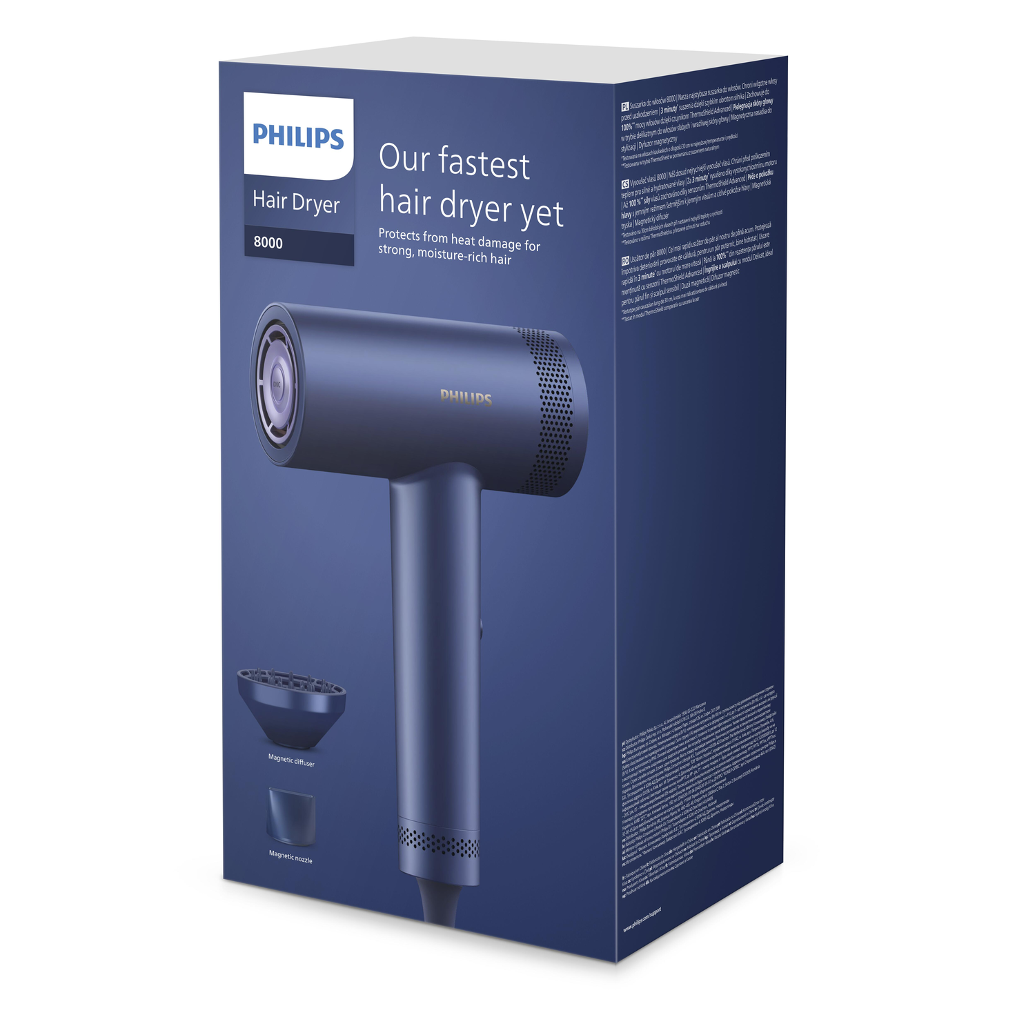 Een blauwe Philips-haardroger in de doos, met de droger en accessoires zichtbaar.