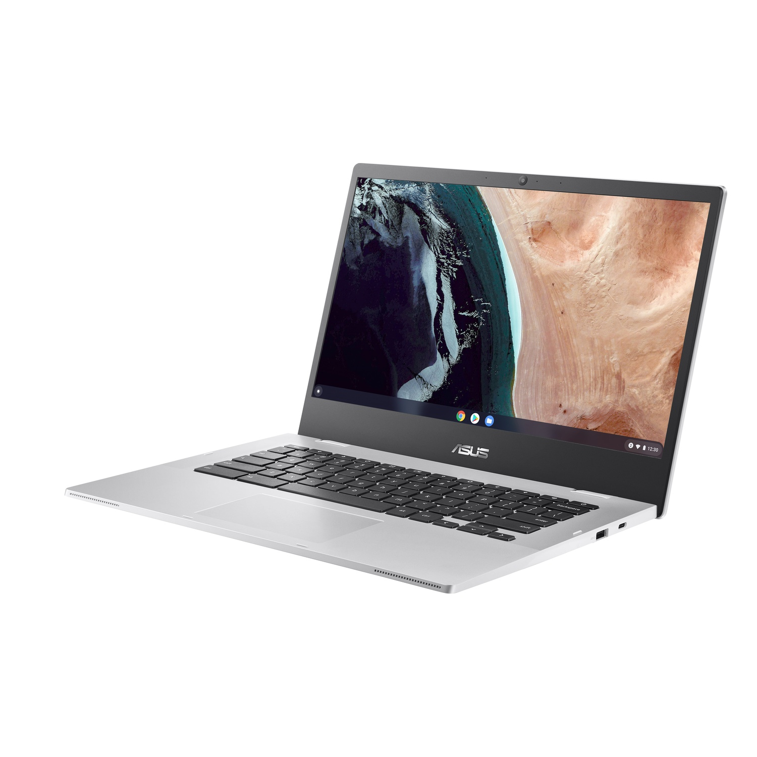 Silver laptop on white background. Open with screen displaying desert landscape.
