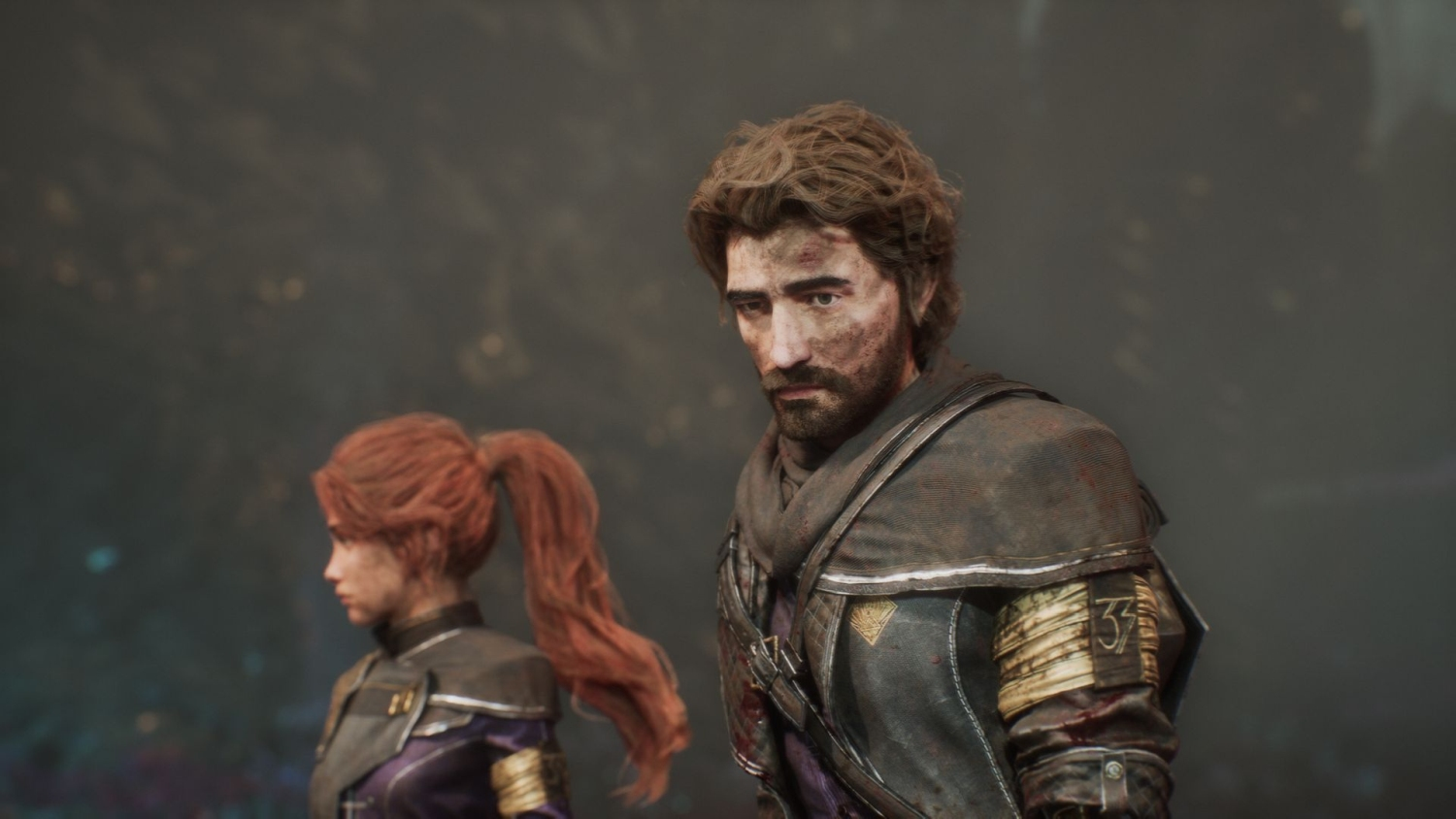 Due persone, un uomo con la barba e una donna con la coda di cavallo, in un'ambientazione medievale.