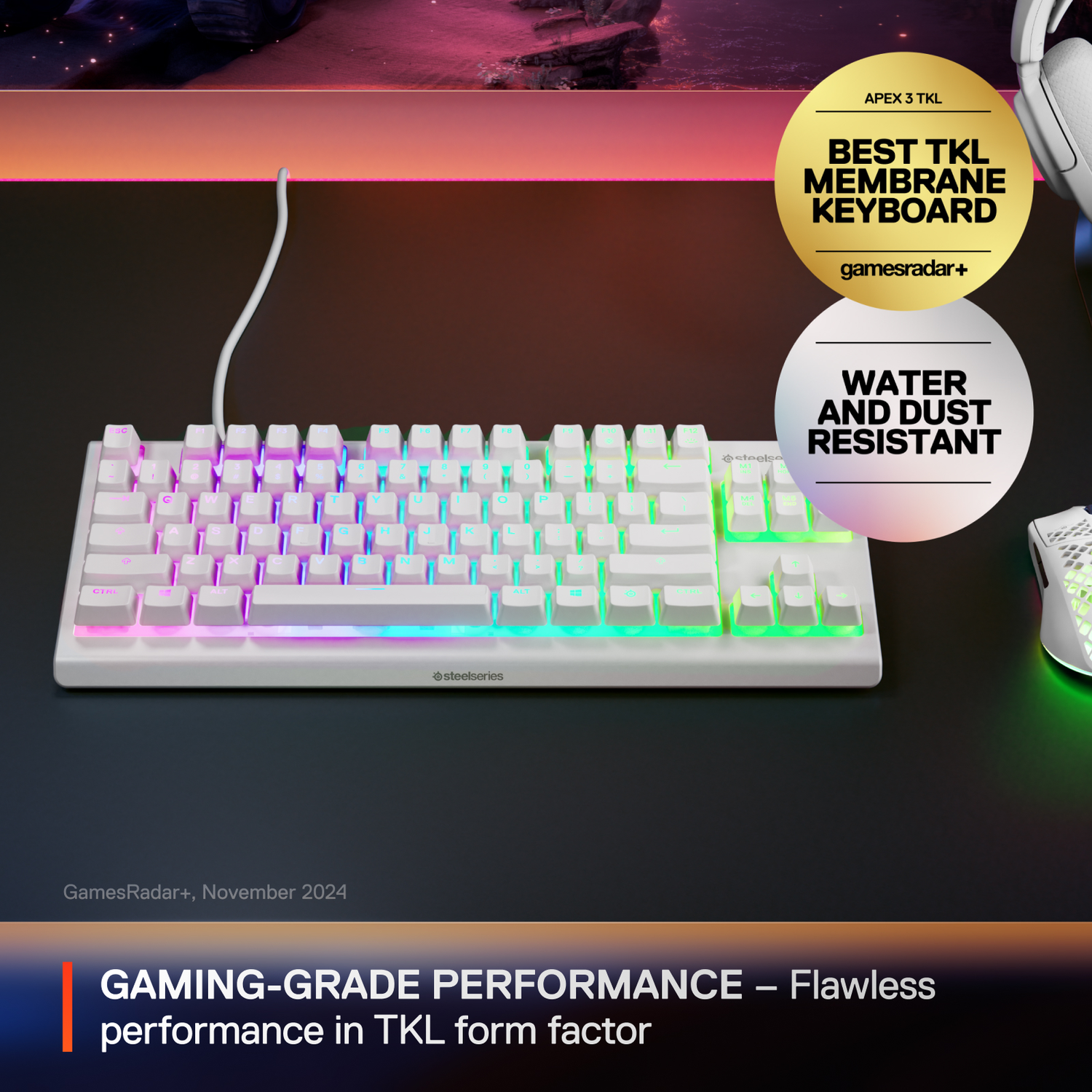 White gaming keyboard with colored lighting. It has a black surface, with two awards on the top right.