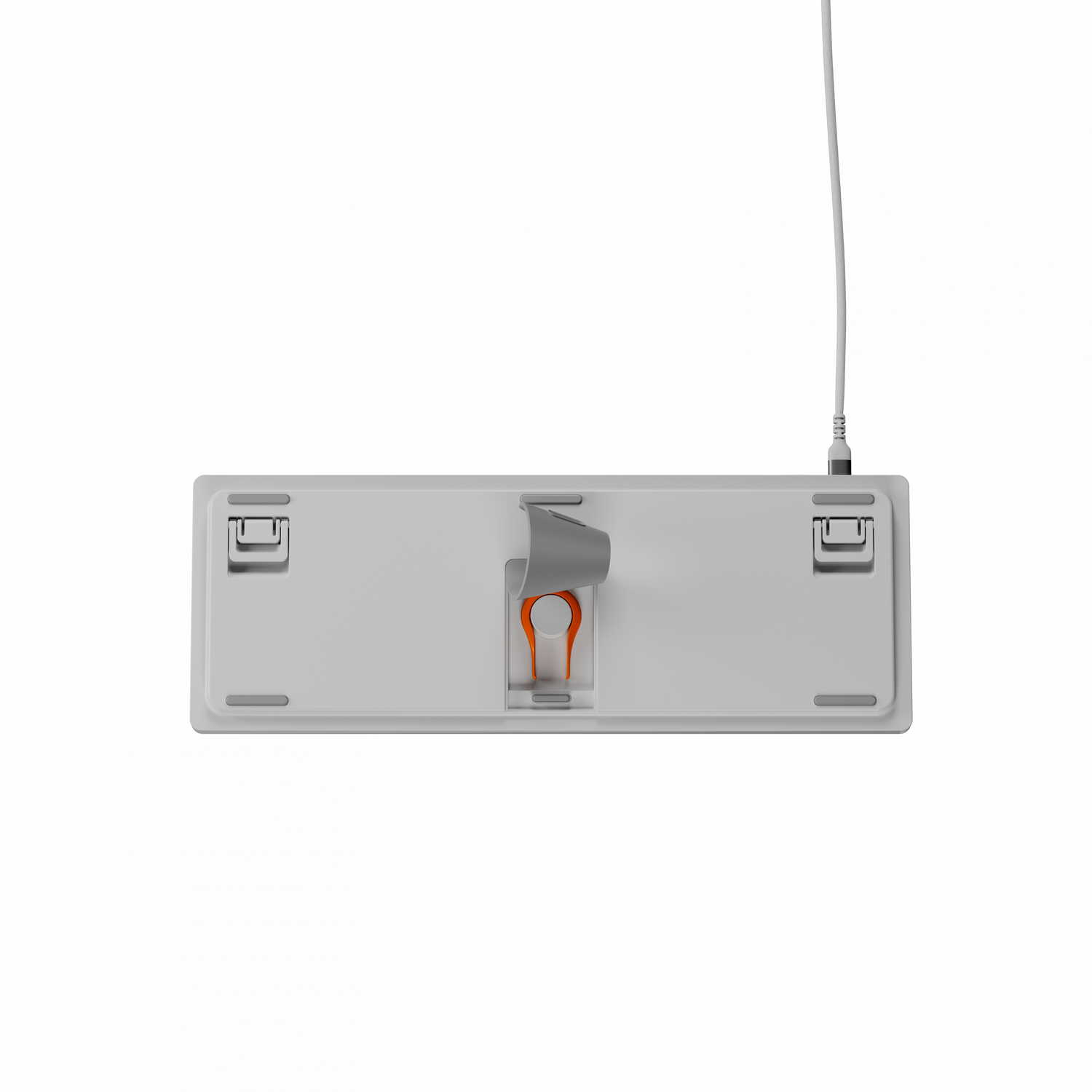 De onderkant van een wit toetsenbord. Een keypuller tool en kabel zijn zichtbaar.