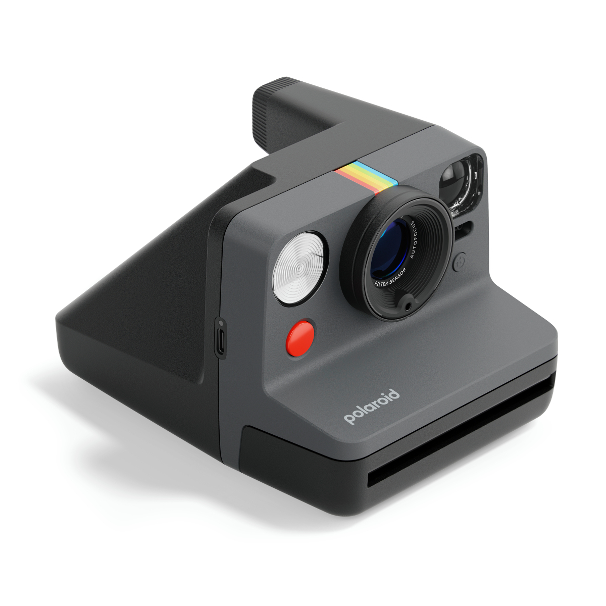 Eine graue Polaroid-Kamera mit schwarzem Oberteil. Sie hat ein Objektiv, einen roten Knopf und einen Regenbogenstreifen.