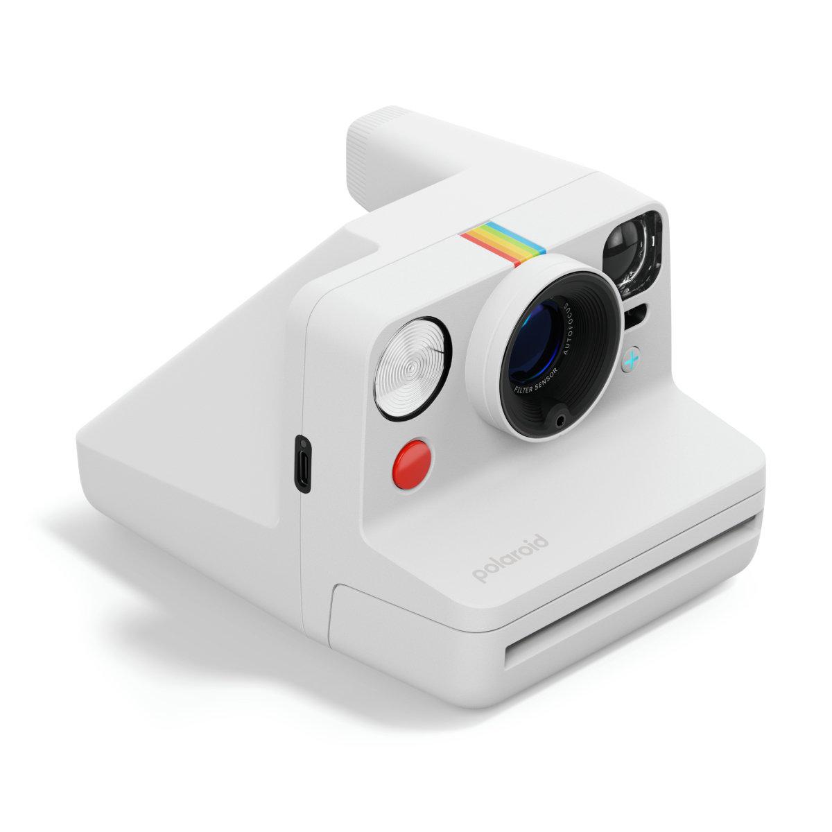 Weiße Polaroid Kamera in Schrägansicht. Roter Knopf, Regenbogenstreifen und 'Polaroid' Text sichtbar.