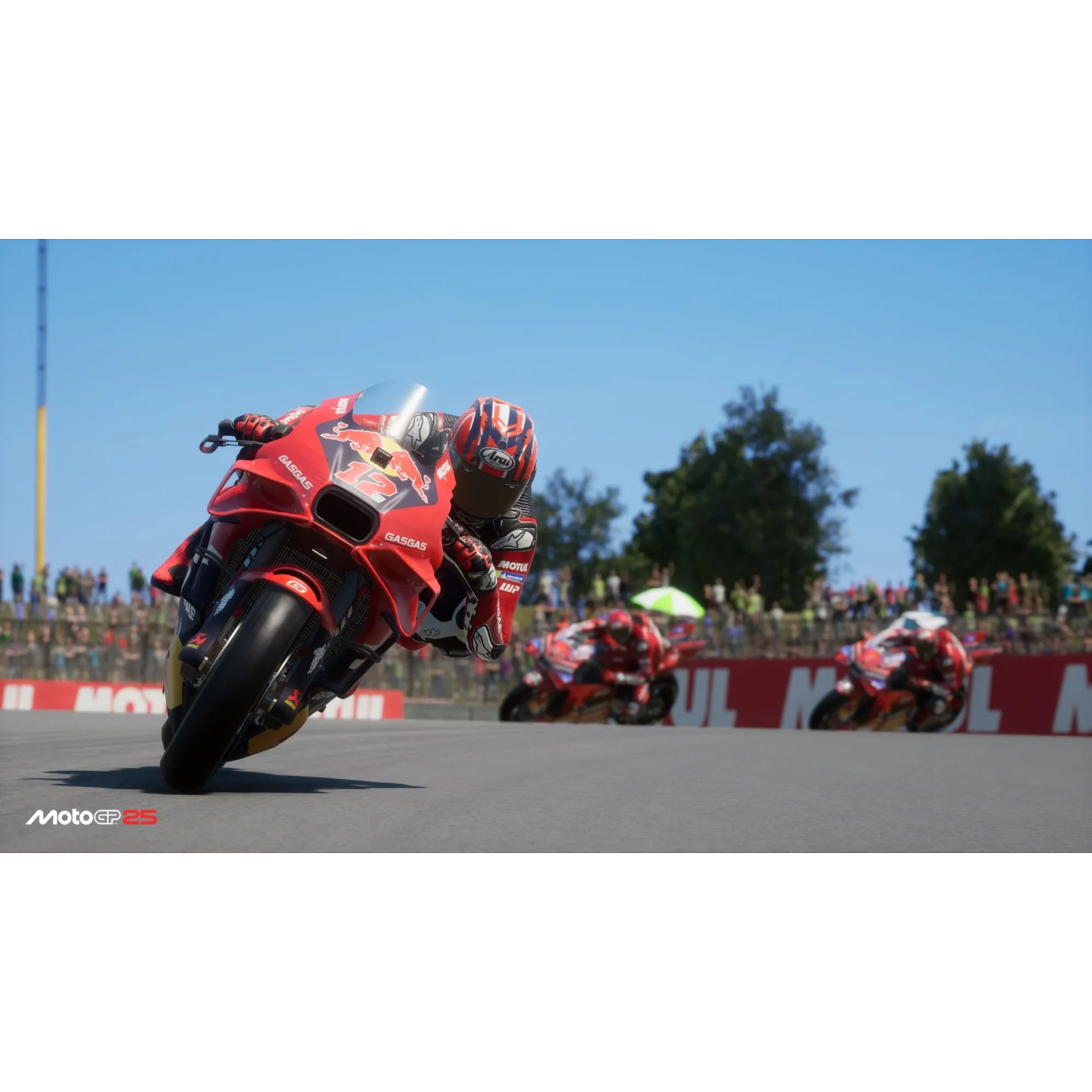 A red motorcycle speeding on a race track with other motorcycles.
