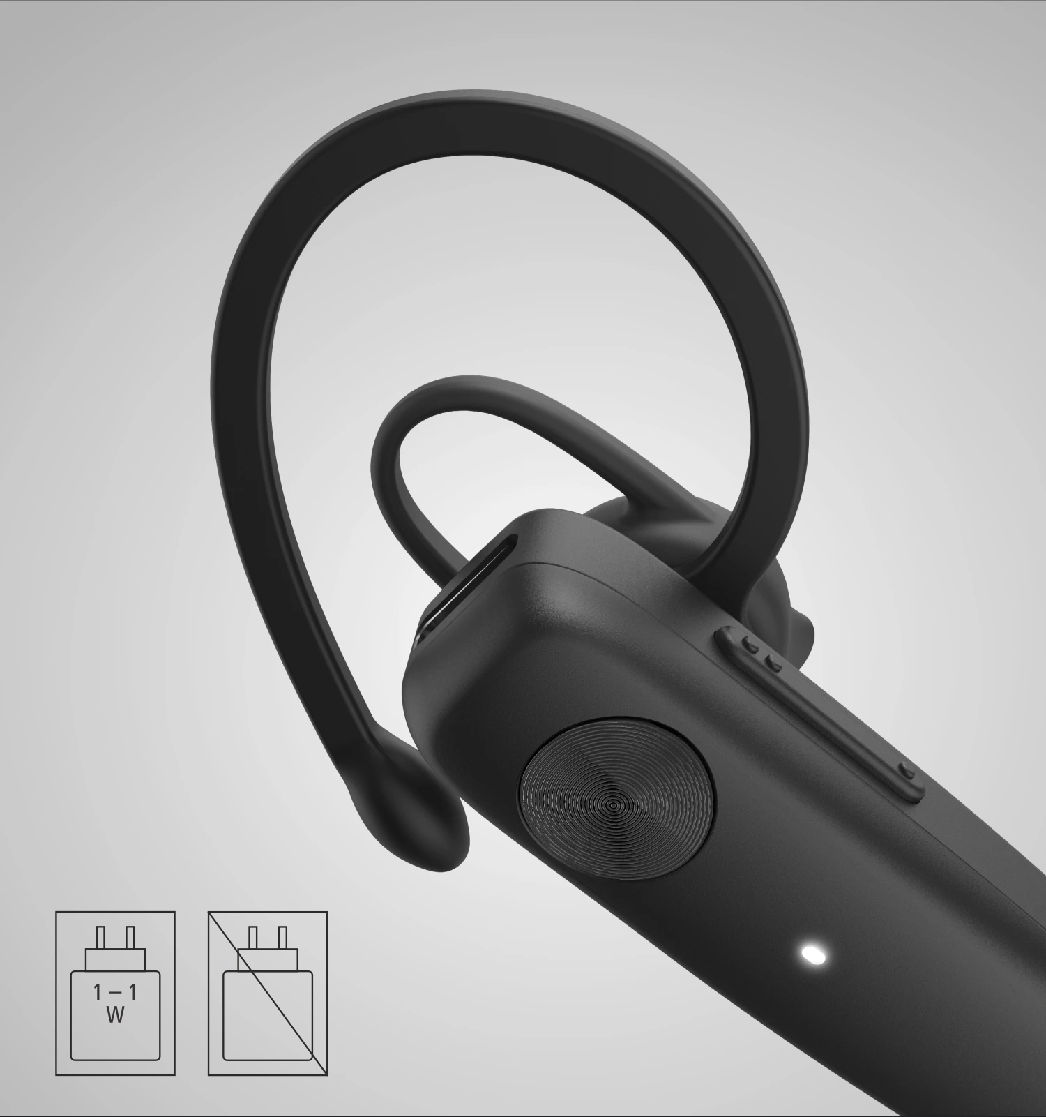 Czarny zestaw słuchawkowy Bluetooth. Ma zakrzywiony zaczep na ucho i przycisk na urządzeniu. Widoczne są dwa symbole wtyczki zasilania.