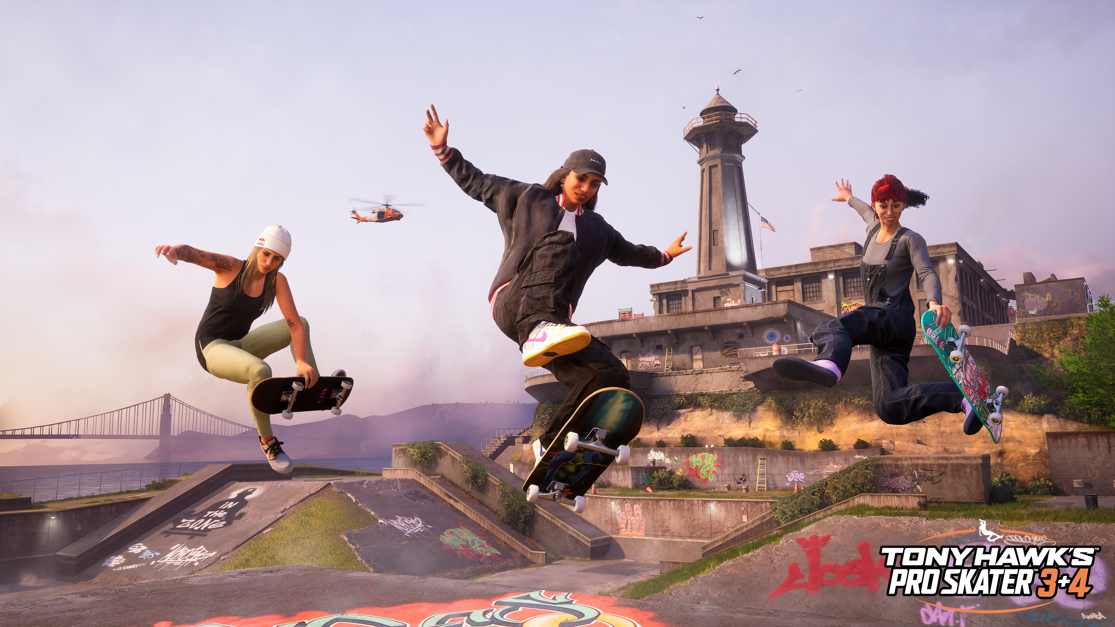 Trois skateurs en l'air dans un skatepark. Ciel clair et pont visible.