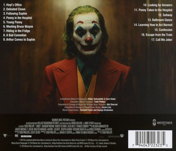 Albumcover mit Person im Clown-Make-up. Rote Jacke, grüne Haare und Text um das Bild herum.