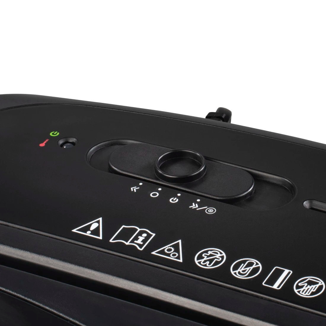 Widok z góry na czarną niszczarkę do papieru z przyciskami sterowania i symbolami ostrzegawczymi.