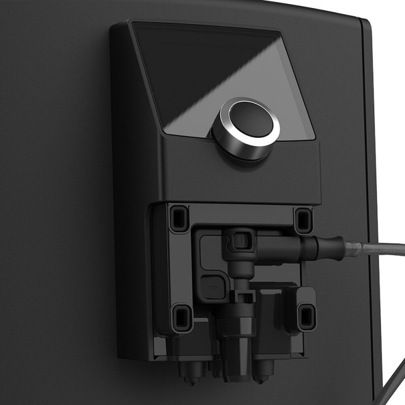 Czarne urządzenie elektroniczne zamontowane na ścianie, z ekranem i pokrętłem sterowania.