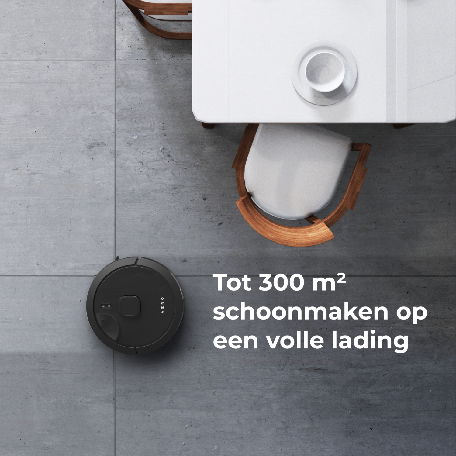 A black robot vacuum on a gray floor with text and furniture.