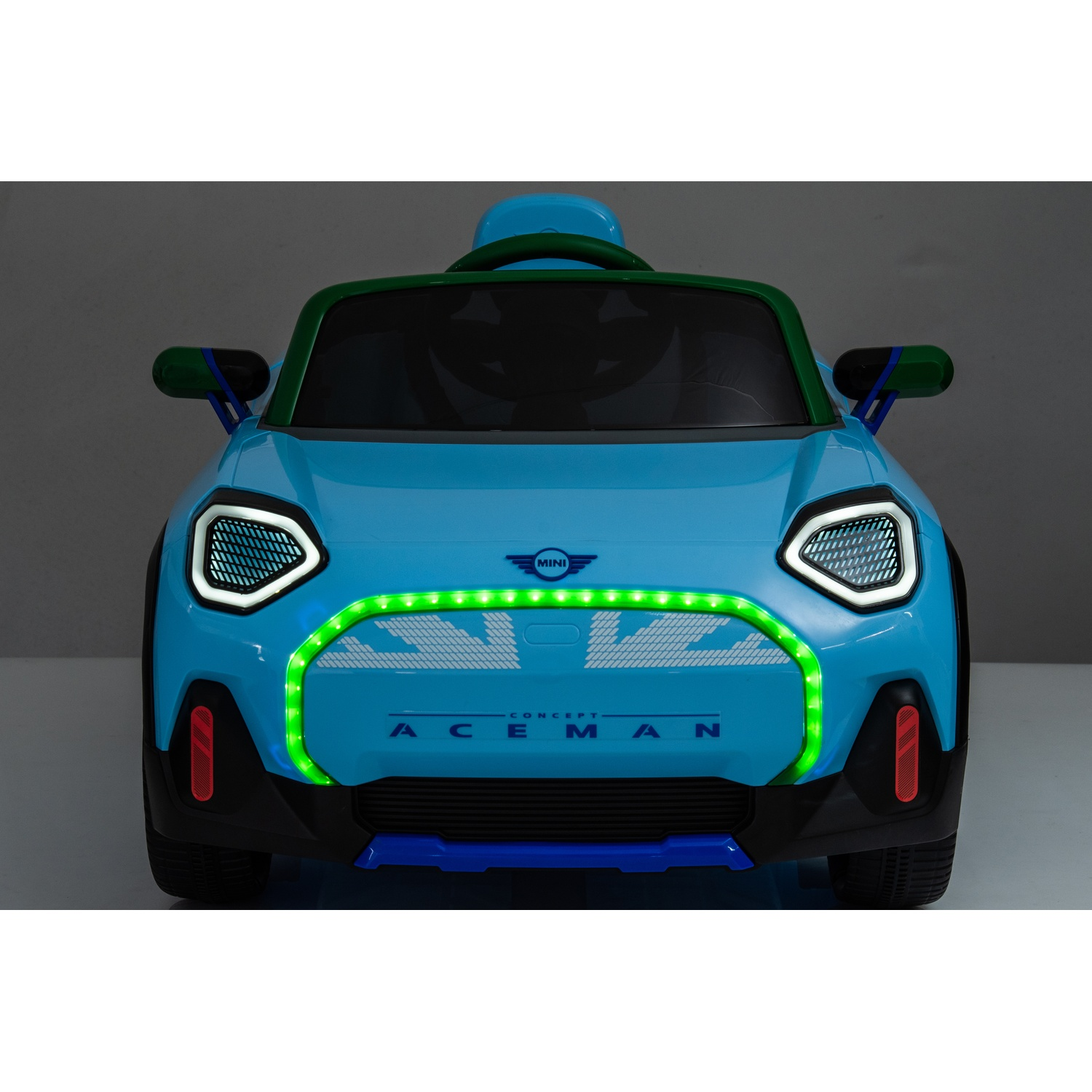 A blue toy car with green and blue accents, lit with green lights.