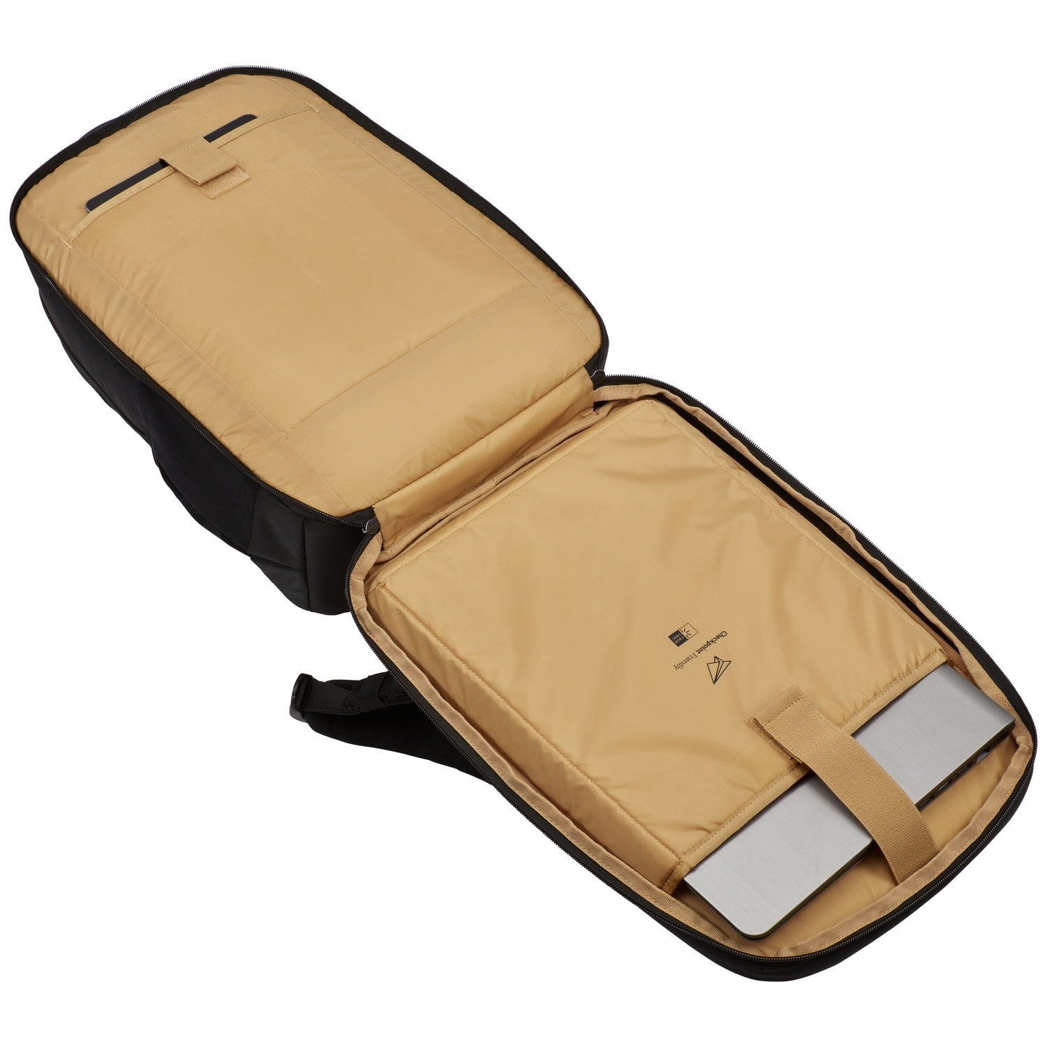 Sac à dos noir ouvert avec un ordinateur portable à l'intérieur. Intérieur beige et une sangle de transport.