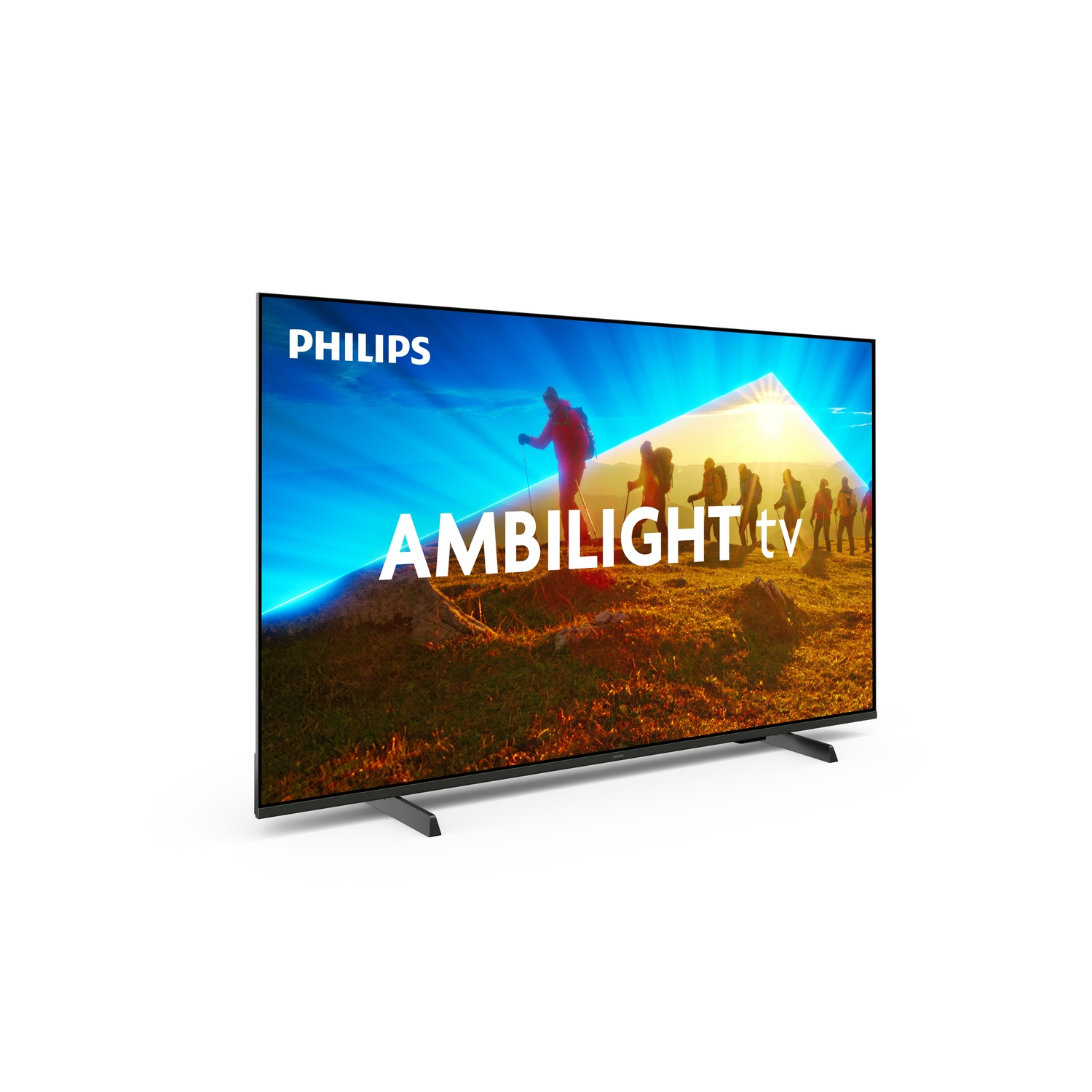 Un téléviseur Philips affiche une scène de montagne avec des personnes marchant. Le mot AMBILIGHT est visible à l'écran.