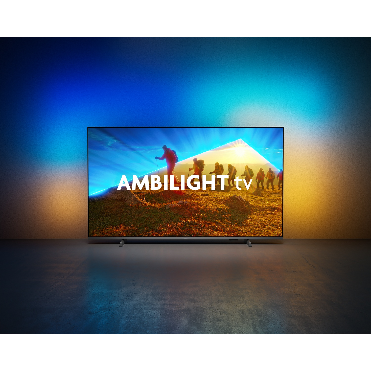 Un grand écran de télévision avec du texte Ambilight TV et des personnes sur une colline.