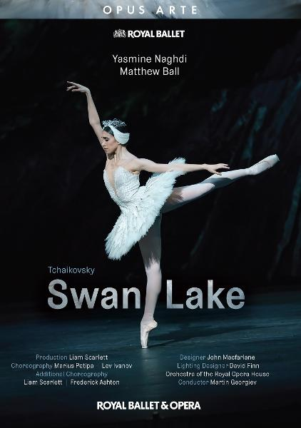 Ballettänzerin auf einer Bühne mit dem Titel 'Schwanensee'.