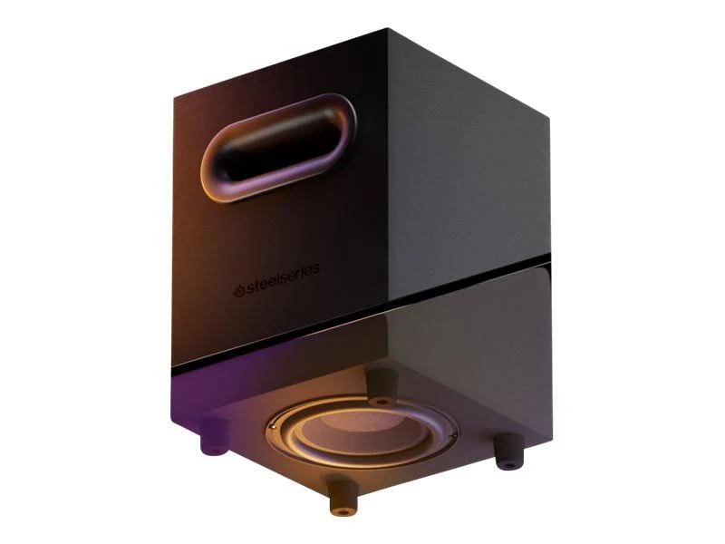 Un altavoz negro con un asa redondeada. El logotipo de SteelSeries es visible. Se ve un cono de altavoz en la parte inferior.