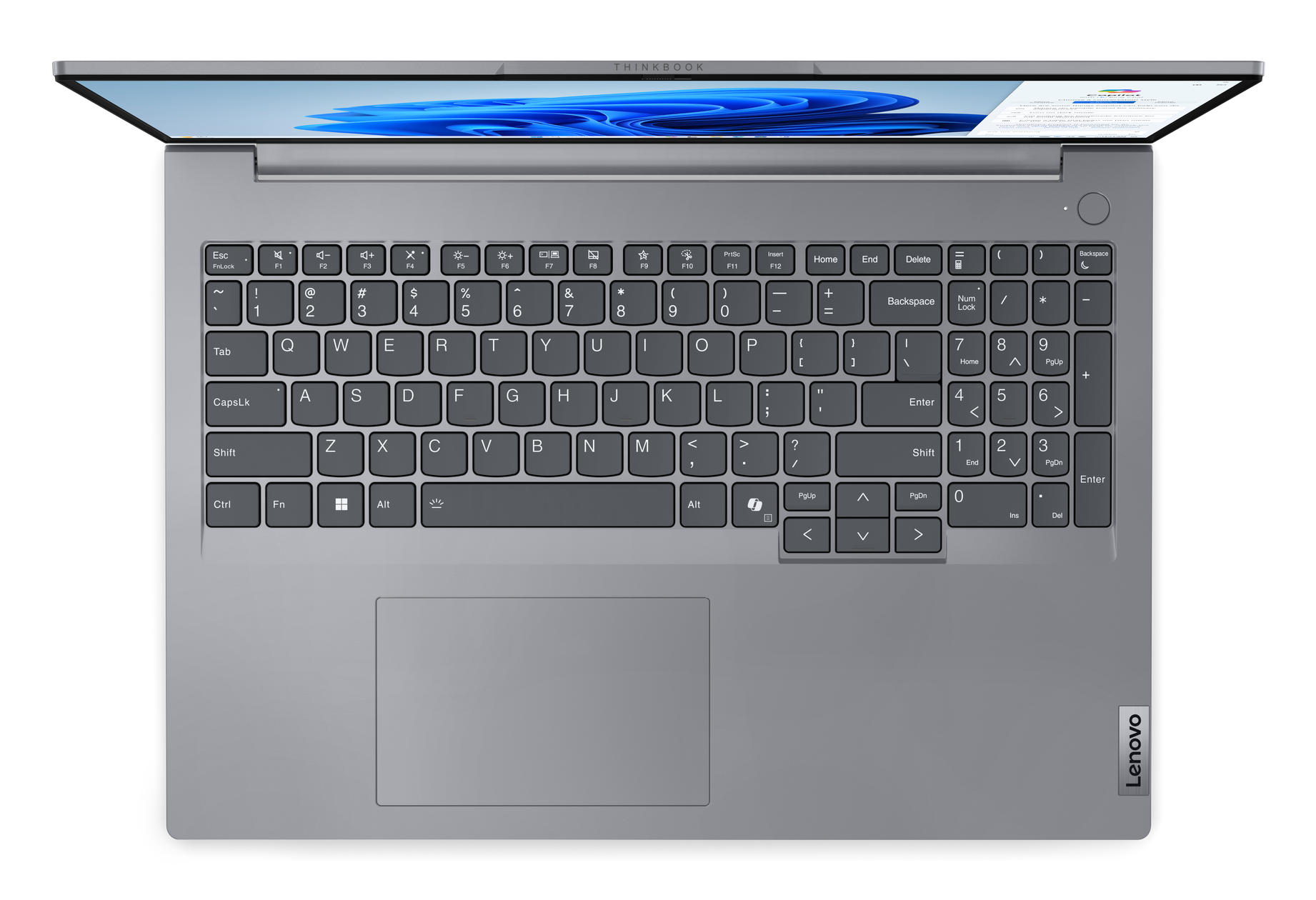 Klawiatura laptopa, widok z góry, z klawiszami i panelem dotykowym na szarej powierzchni.