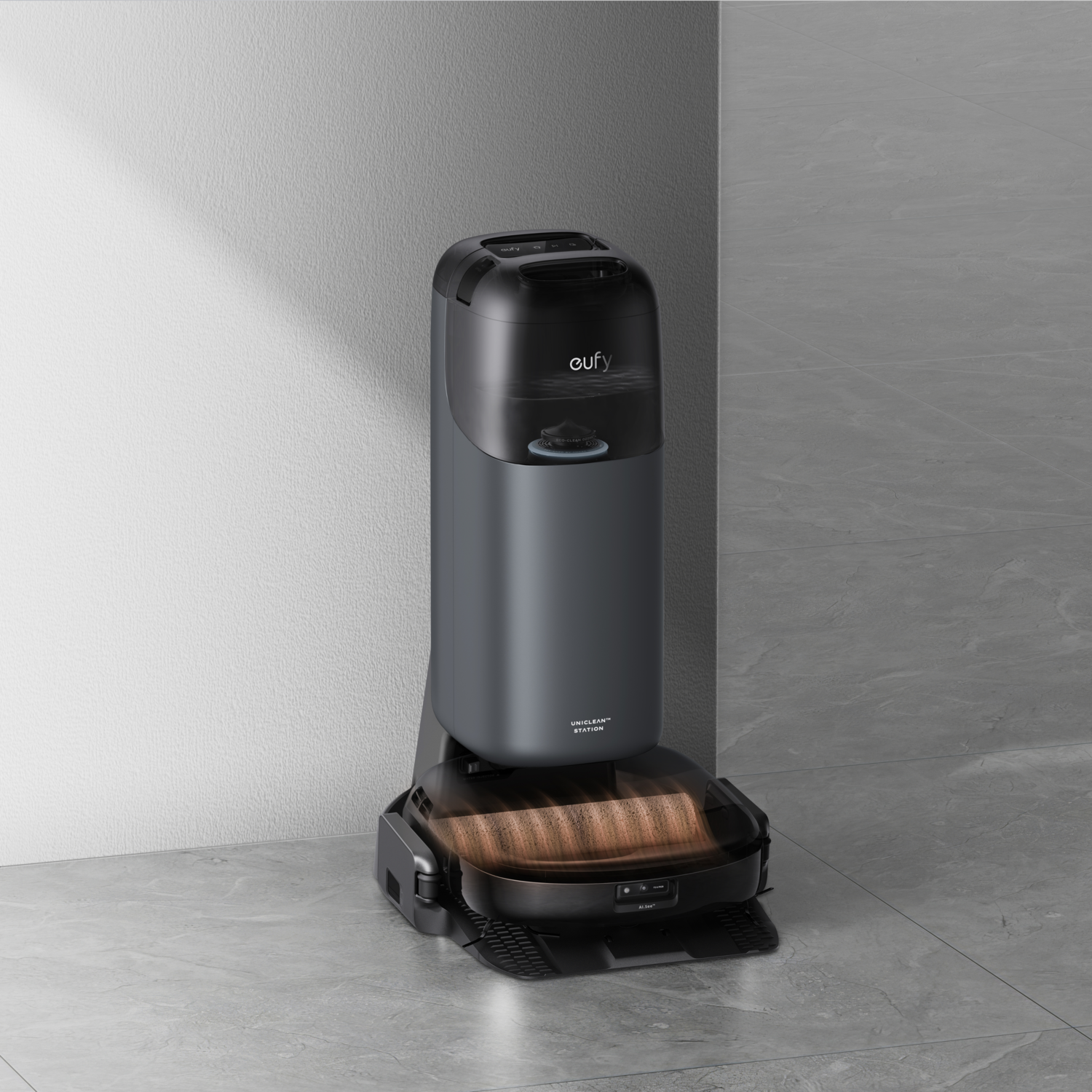 Un aspirateur robot debout contre un mur.