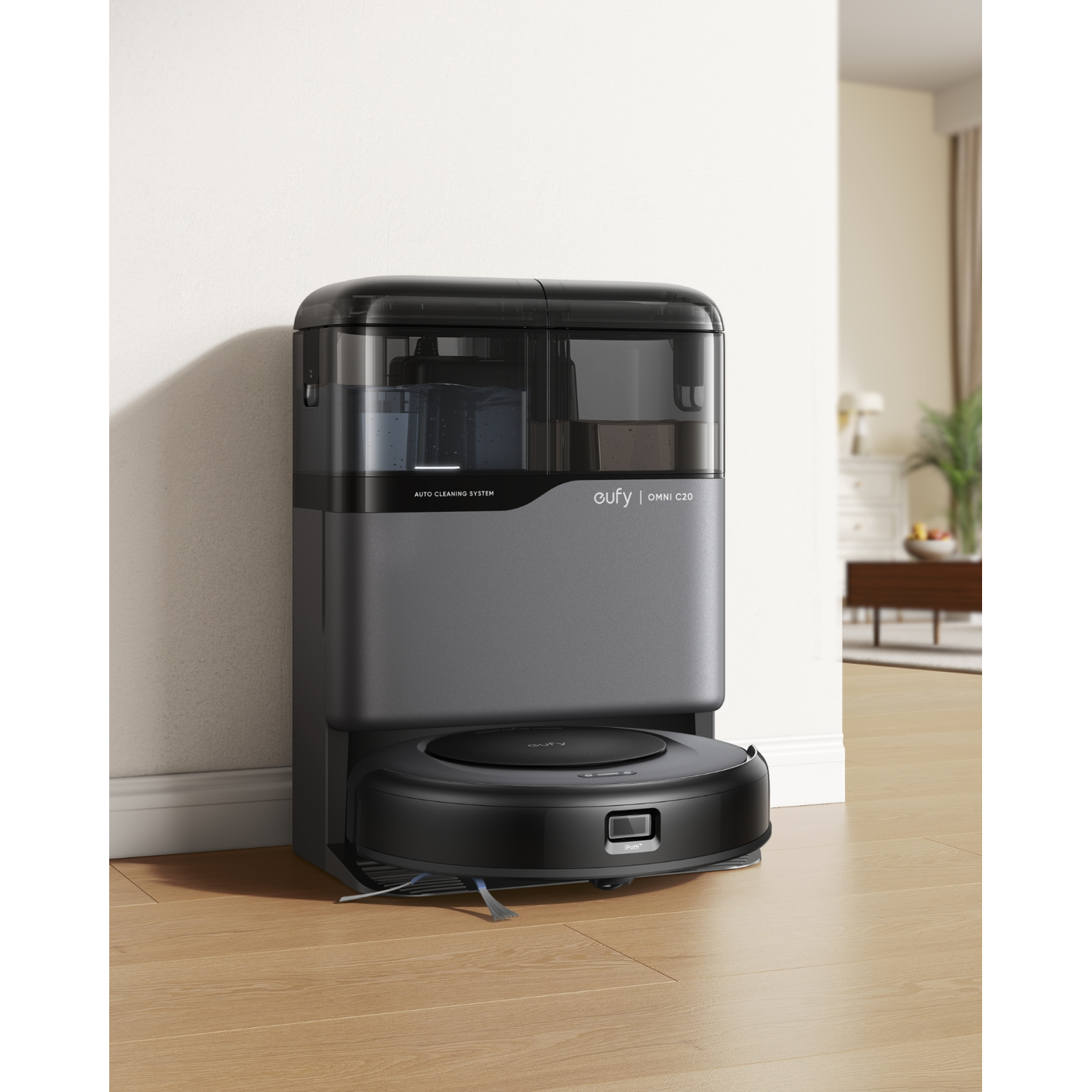 Robot aspirateur et station de charge/nettoyage, sol en bois.