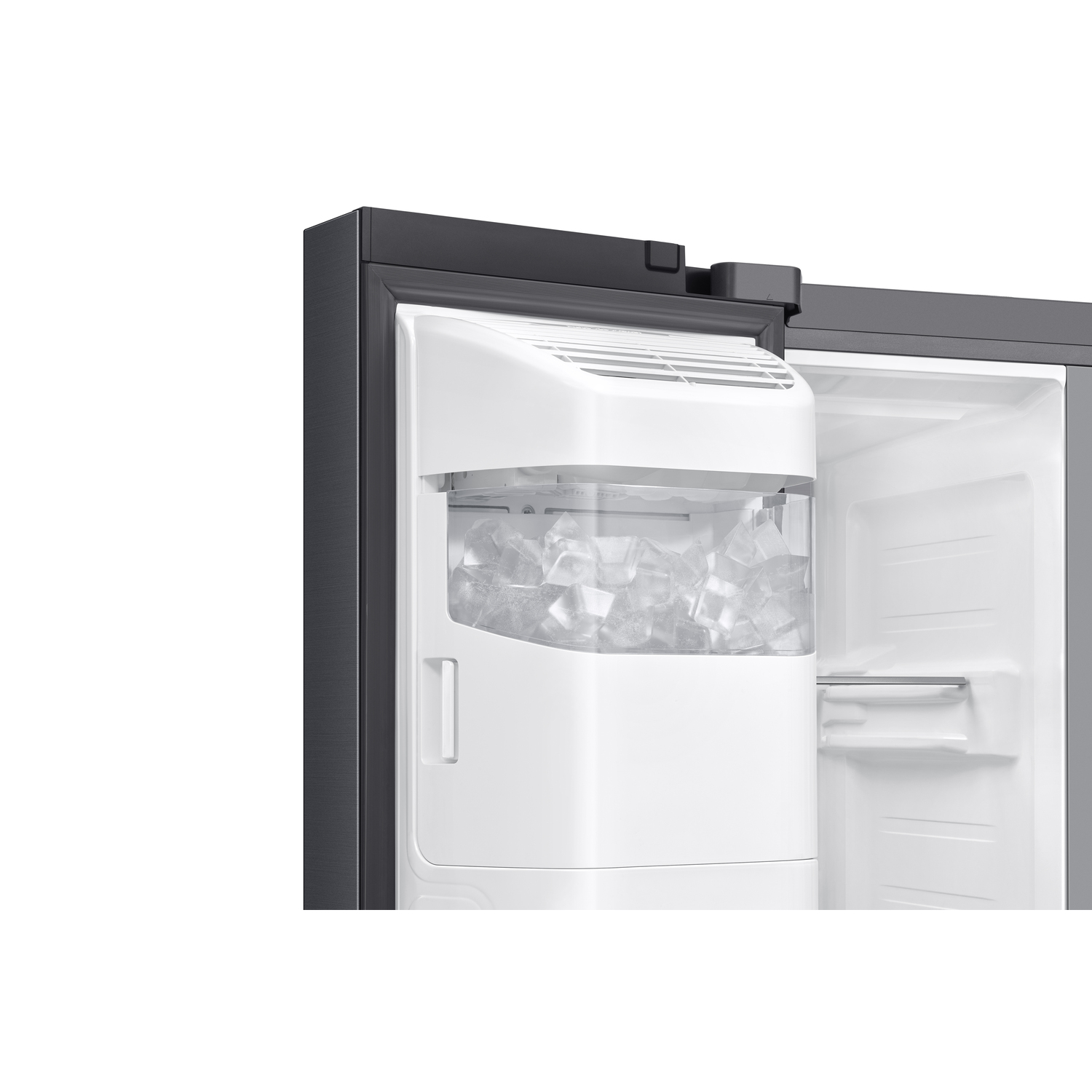 An open refrigerator door with an ice maker filled with ice cubes.