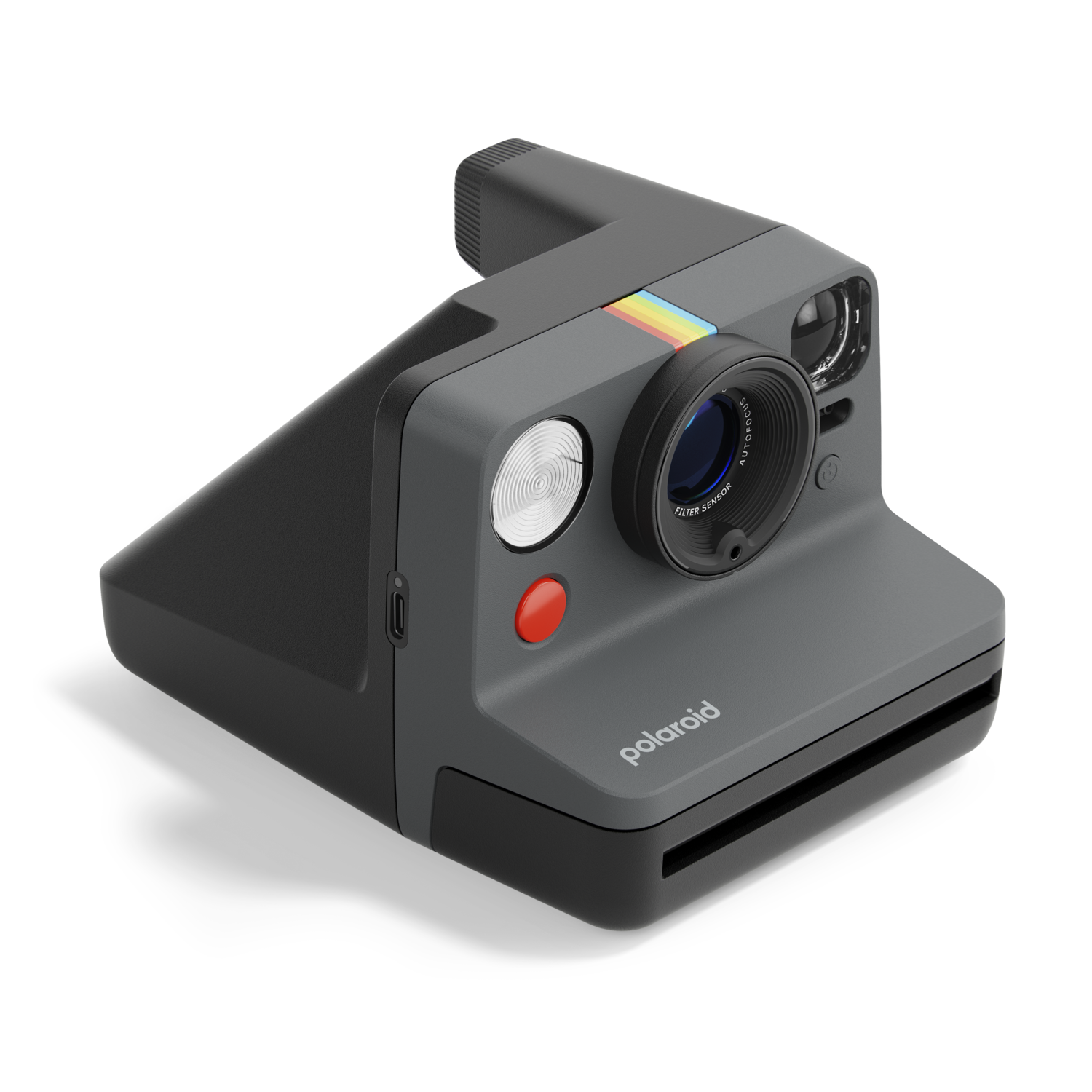 Polaroid camera, grey body, black lens, red button, rainbow stripe, and flash. Isolated on black.