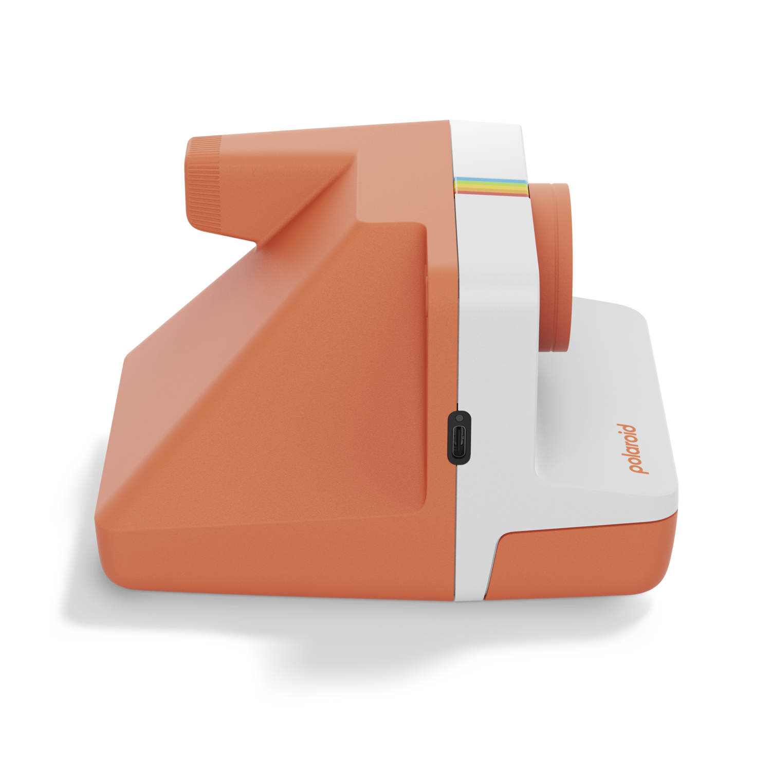 Orange and white Polaroid camera on a black background.