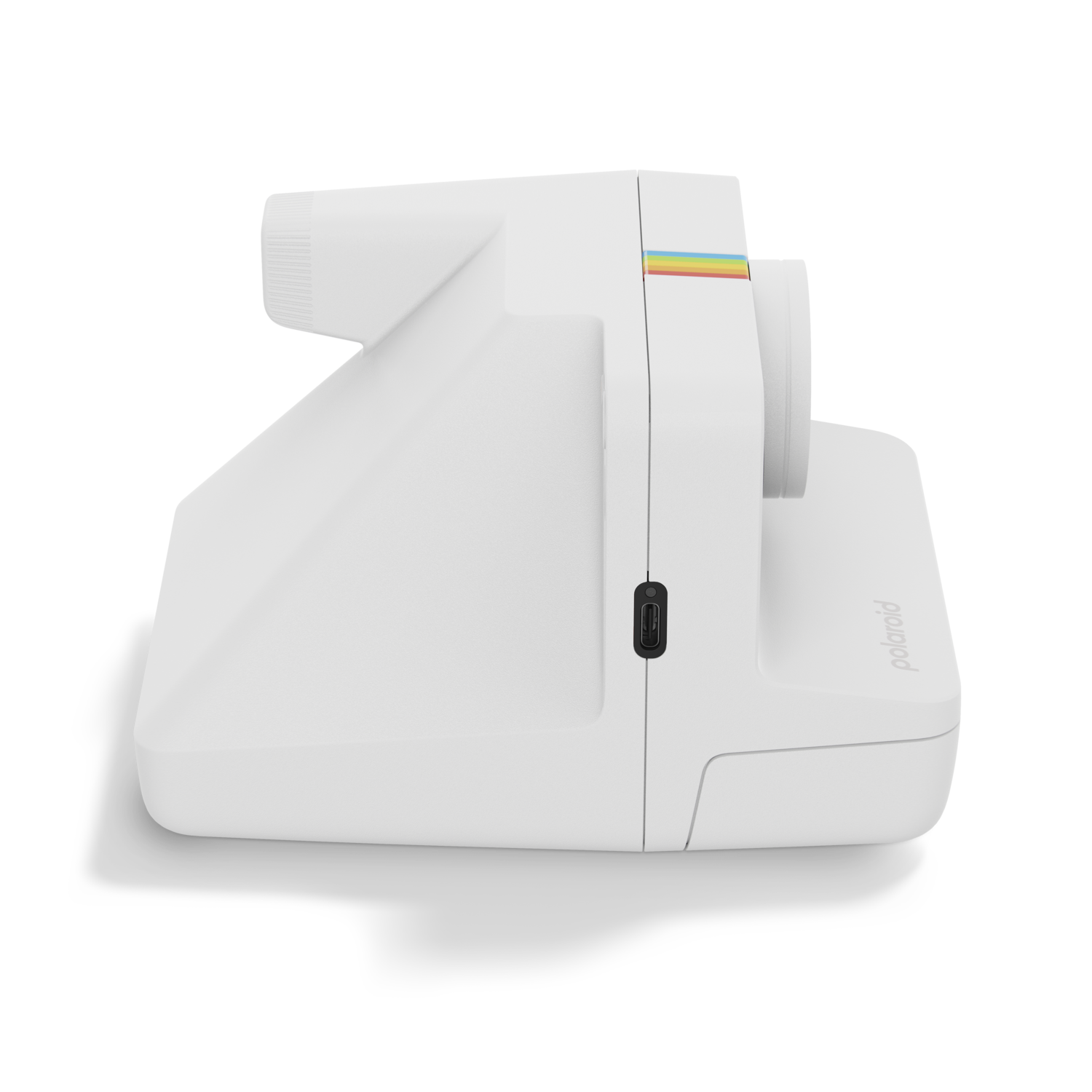 White Polaroid camera. Side view with a rainbow stripe, black USB port. Black background.