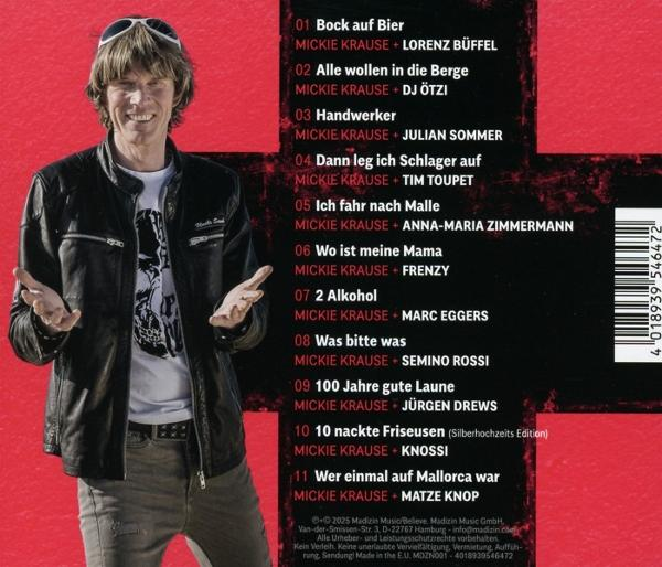 Mann lächelt, Arme offen; Albumcover mit Titeln und Künstlernamen in Rot auf rotem Hintergrund.