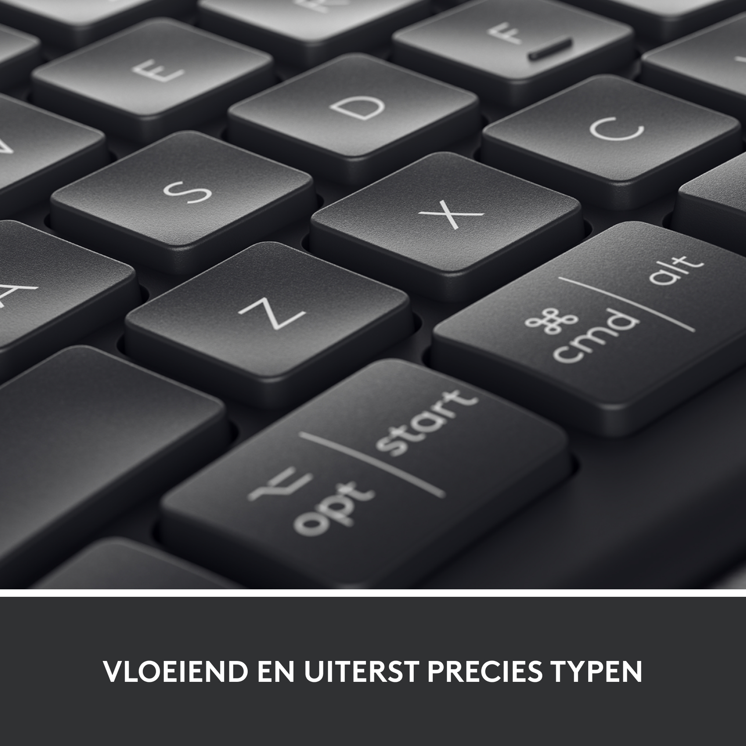 Close-up of a dark gray keyboard. The keys are flat and modern.
