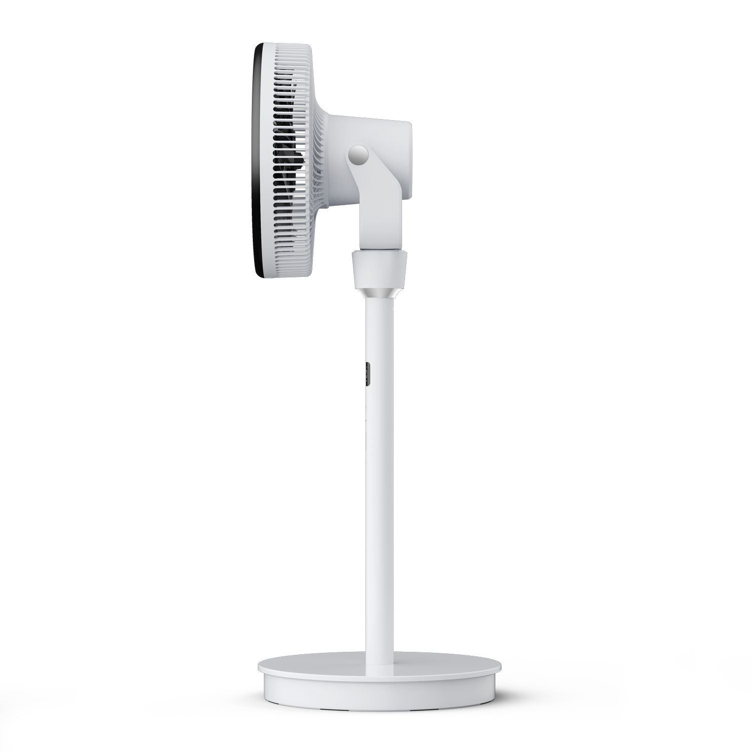 White standing fan, side view. The fan head is black and white. The base is circular.