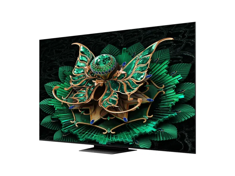 Moderner Fernseher mit dekorativem, grün-goldenem Blumendesign auf dem Bildschirm.