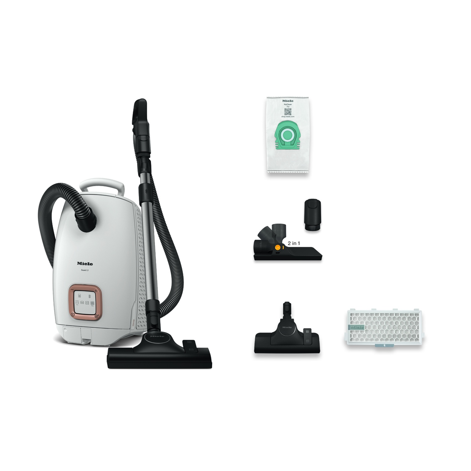 Un aspirapolvere Miele bianco con accessori. Sono visibili un sacco e degli attrezzi.