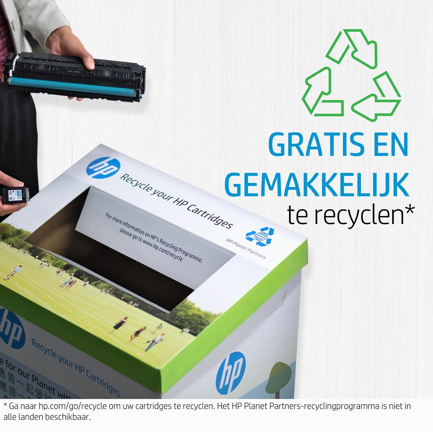Person holding a black cartridge, with a recycling bin. Text promotes recycling HP cartridges.