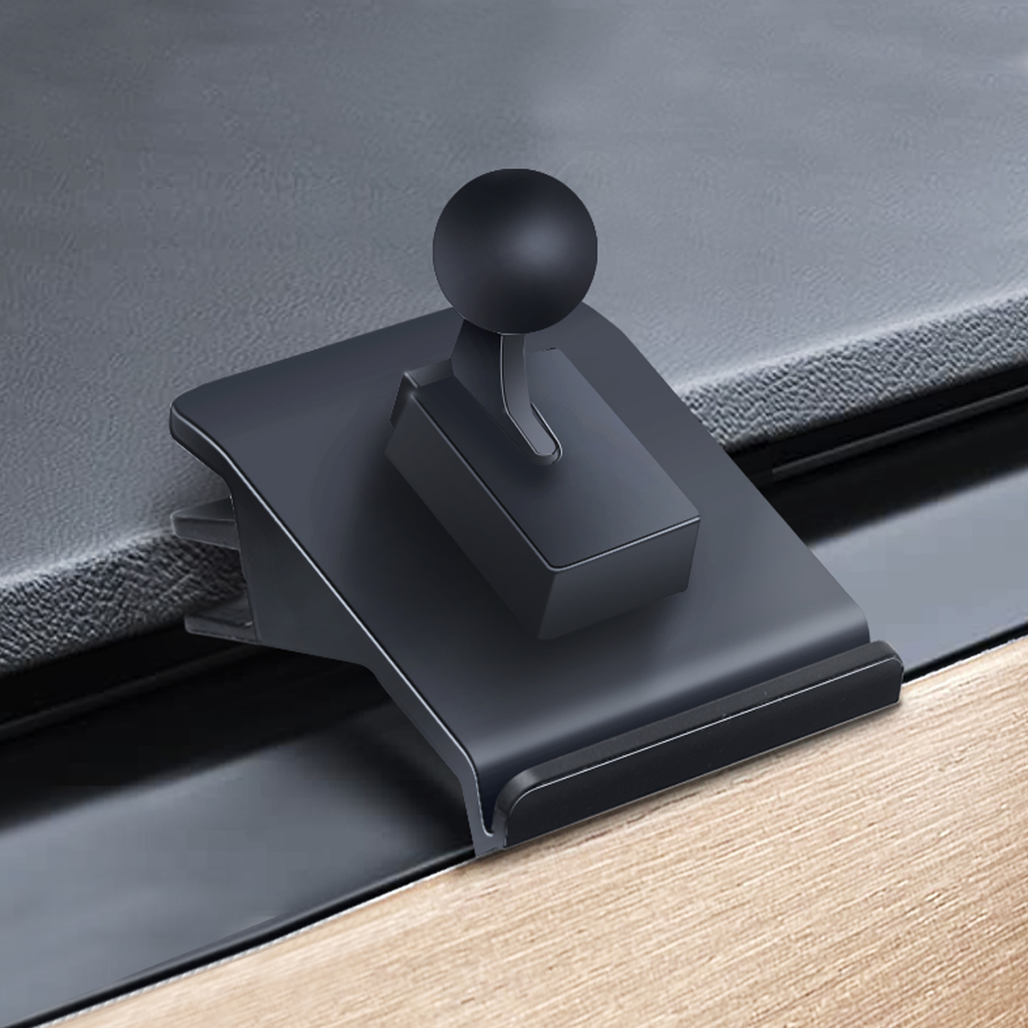 Support de téléphone de voiture noir avec rotule, monté sur une surface de tableau de bord.